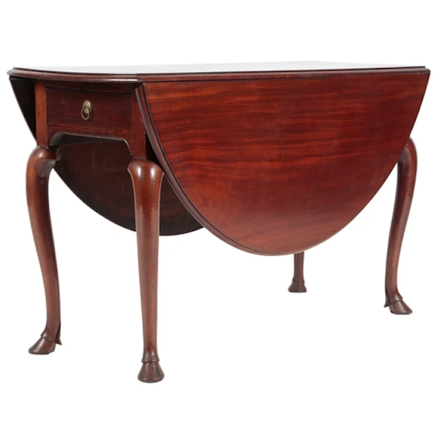 A George II mahogany drop leaf table, the oval top with moul...