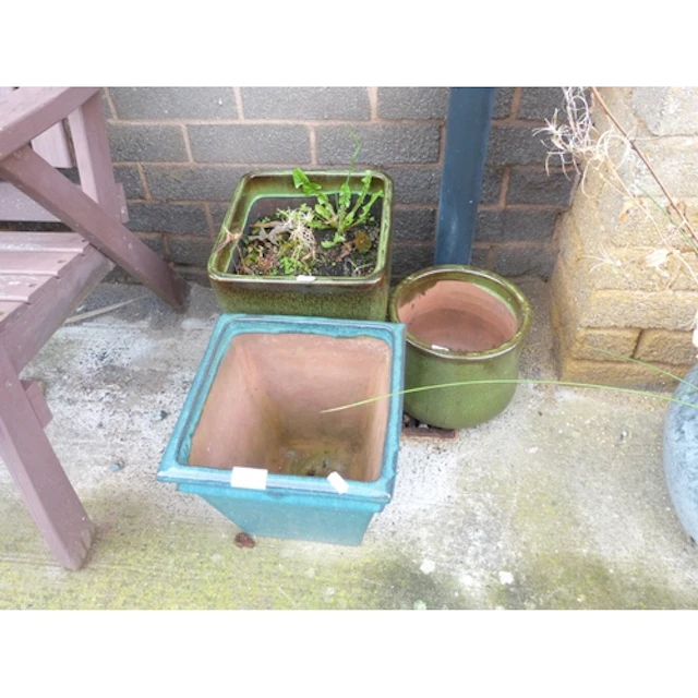 Three small ceramic garden planters.