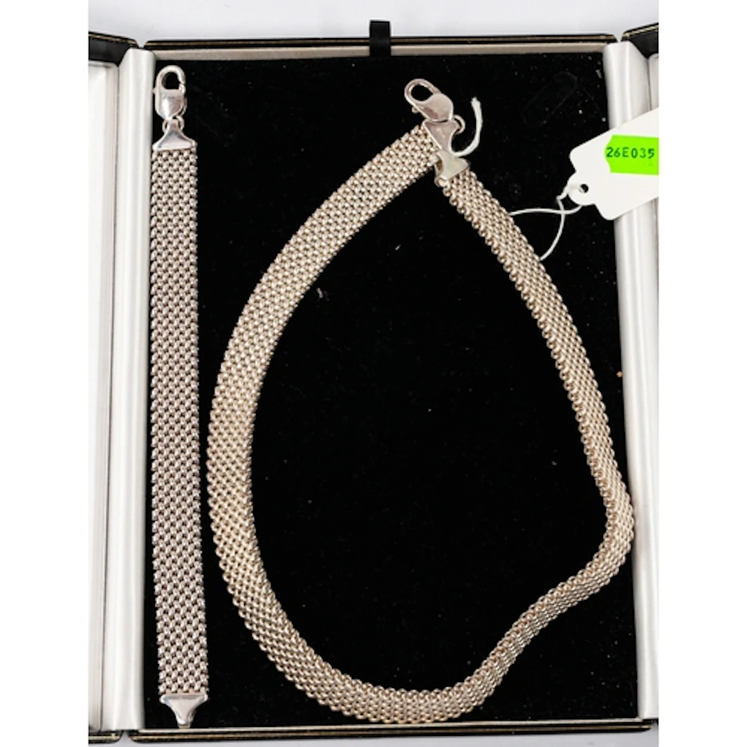 Jewellery: a white metal mesh necklace and bracelet set, bot...