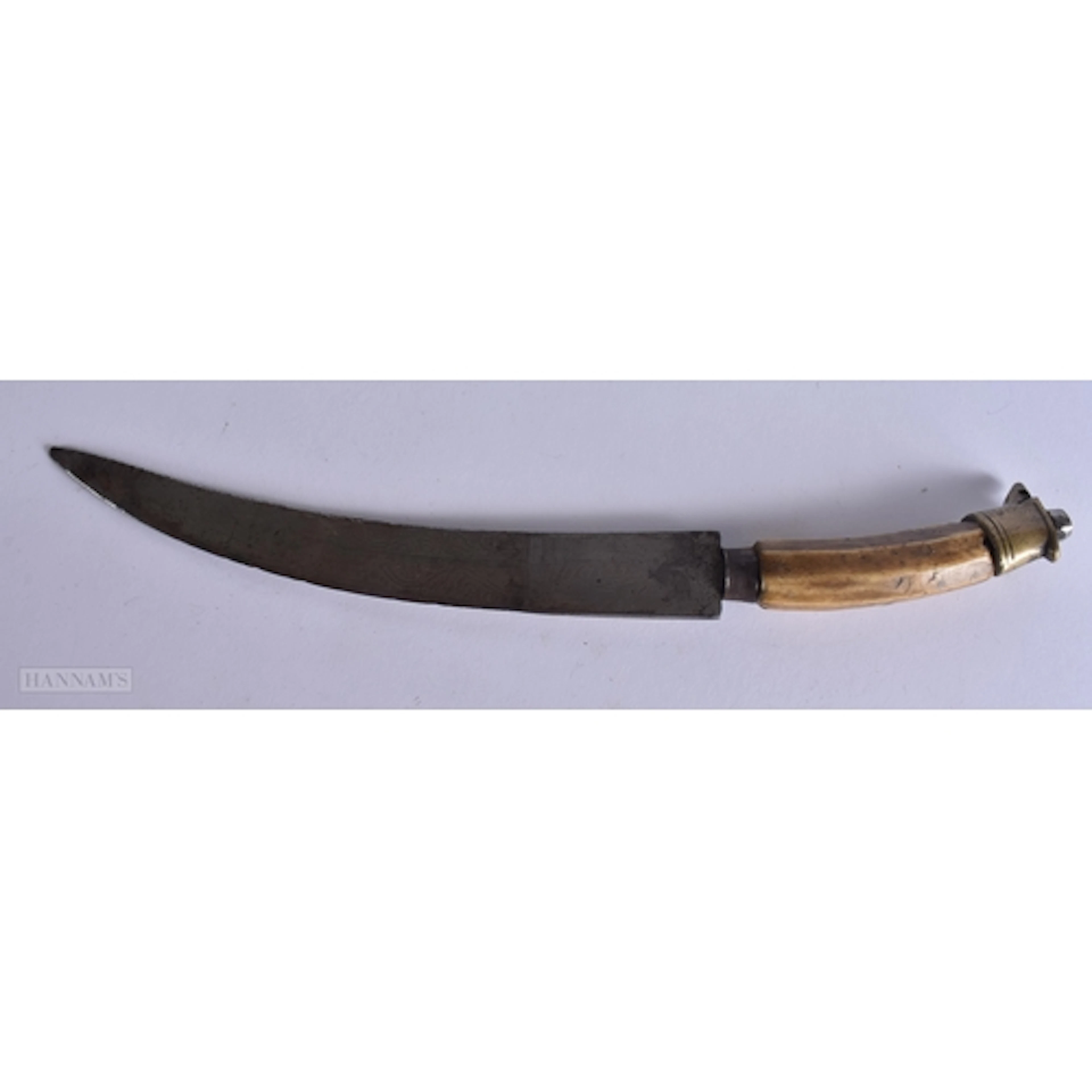 AN ISLAMIC DAGGER. 28 cm wide.
