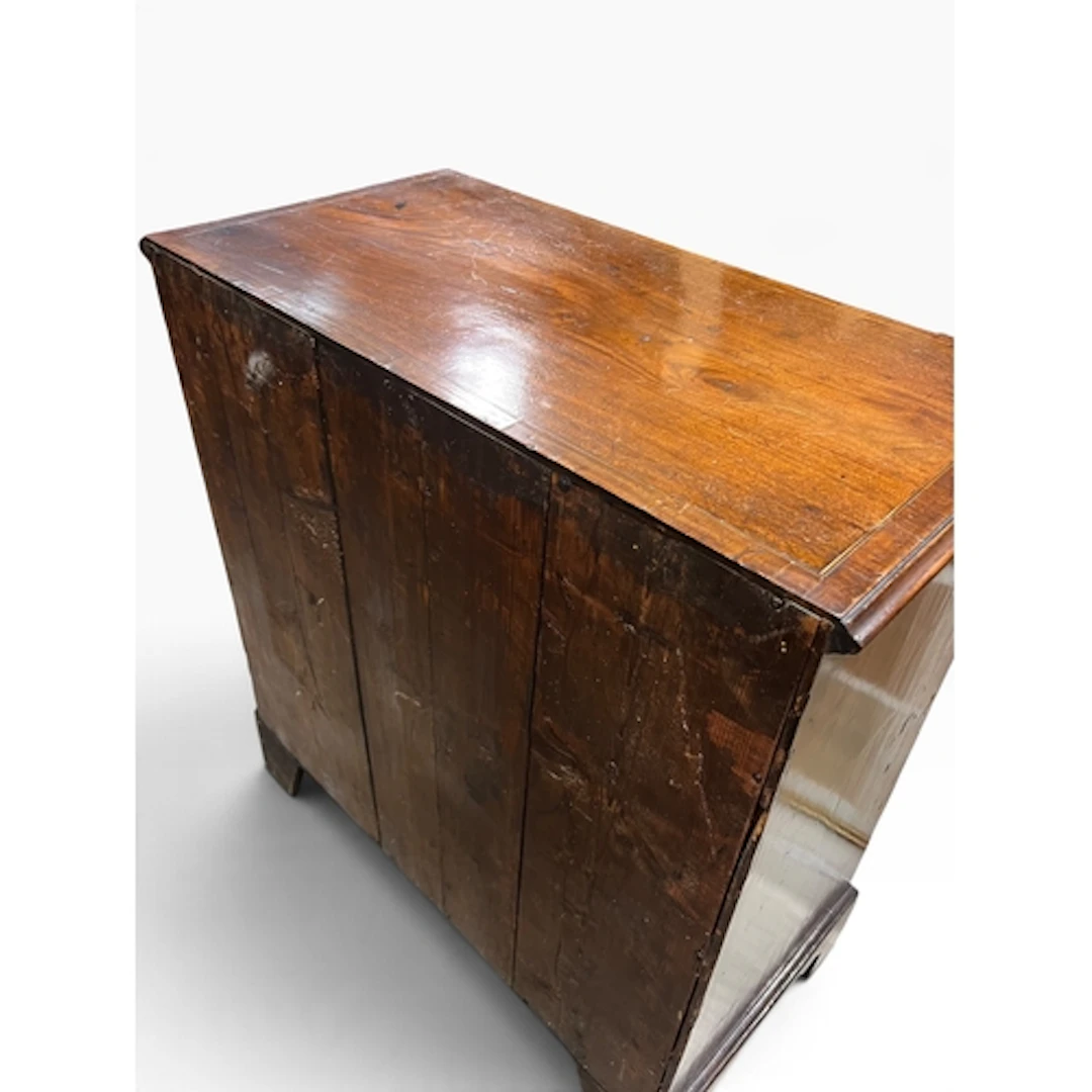 A GEORGIAN MAHOGANY CHEST OF DRAWERS Two short over three lo...