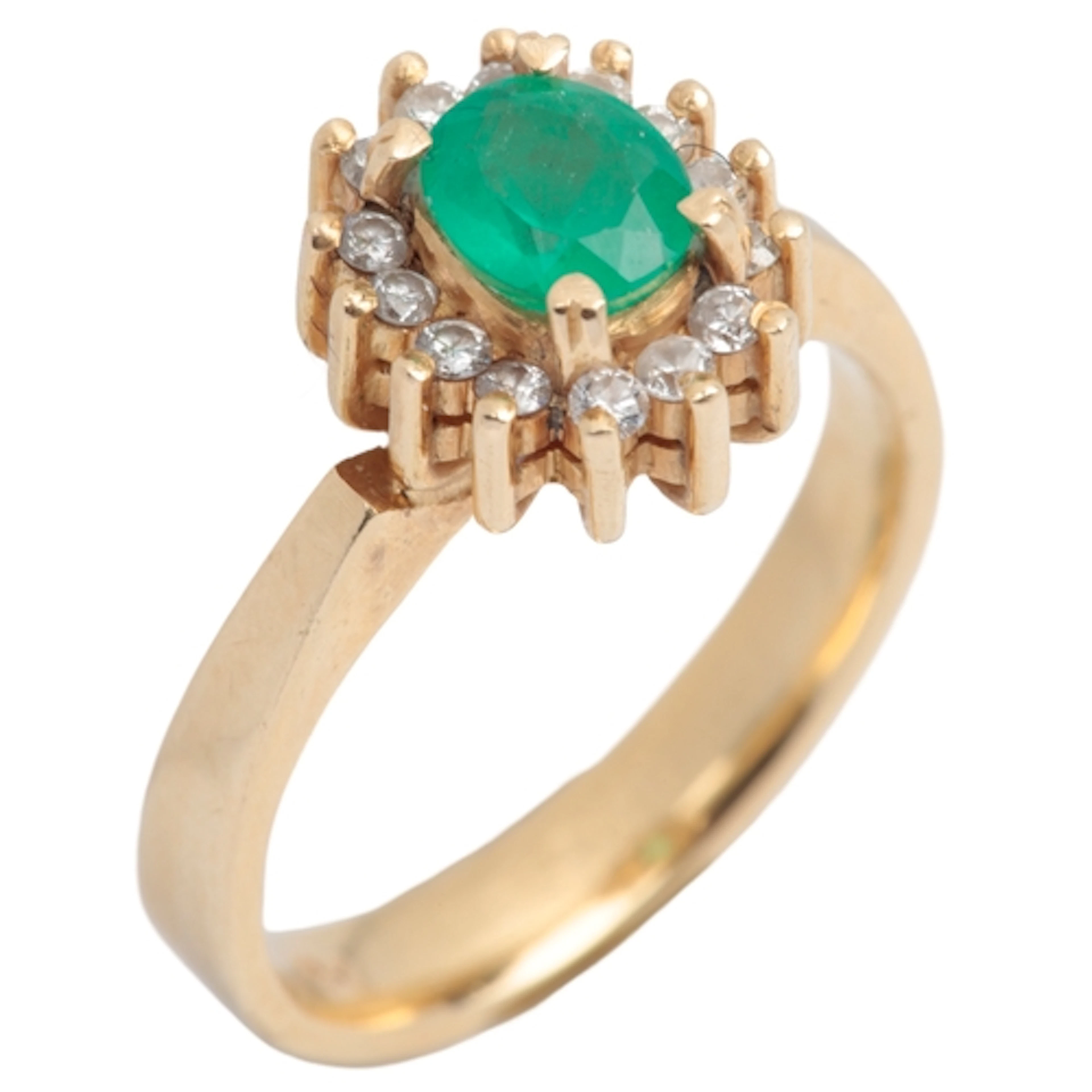An emerald and diamond cluster ring, claw-set with an oval e...