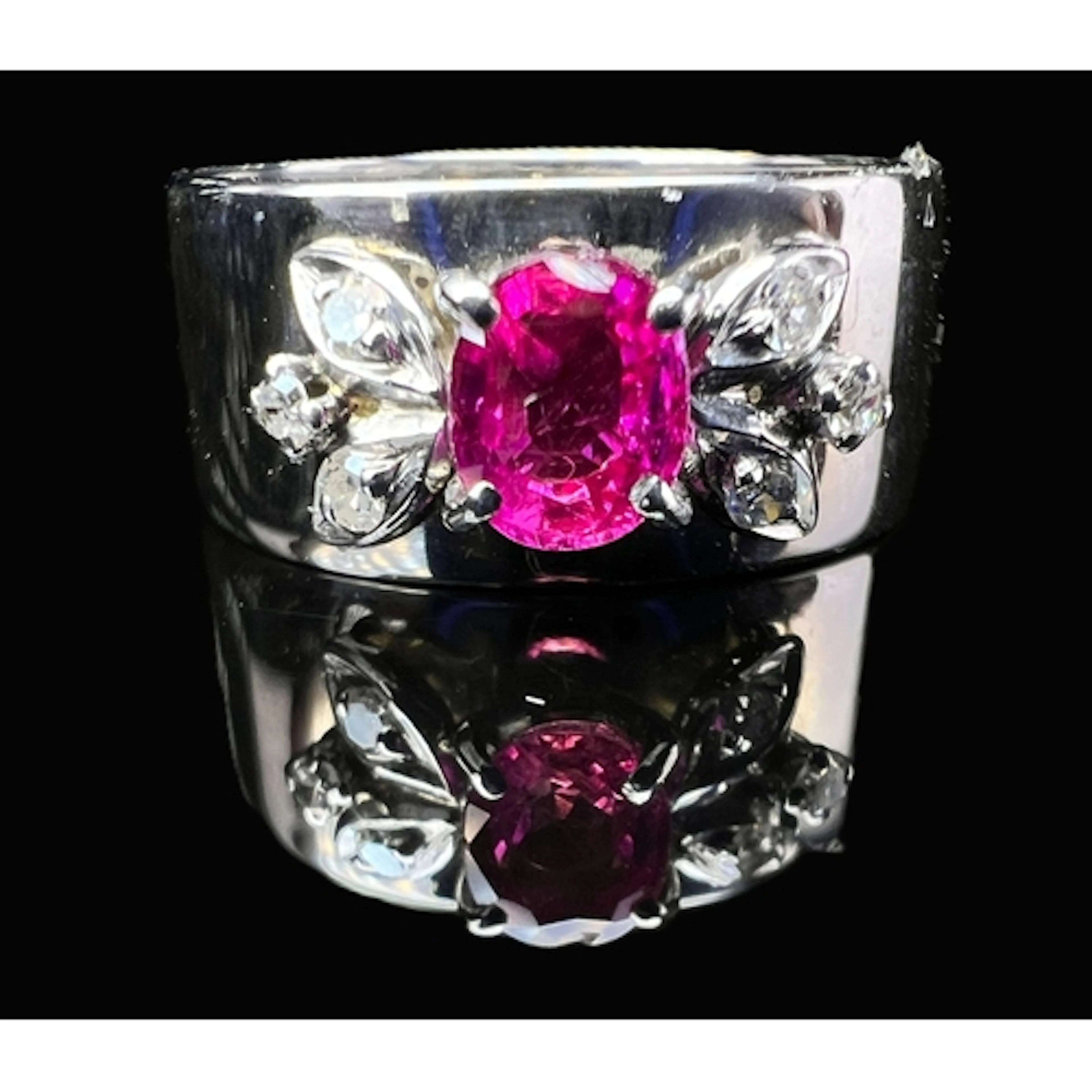 A 9 carat hallmarked white gold dress ring, a broad band set...