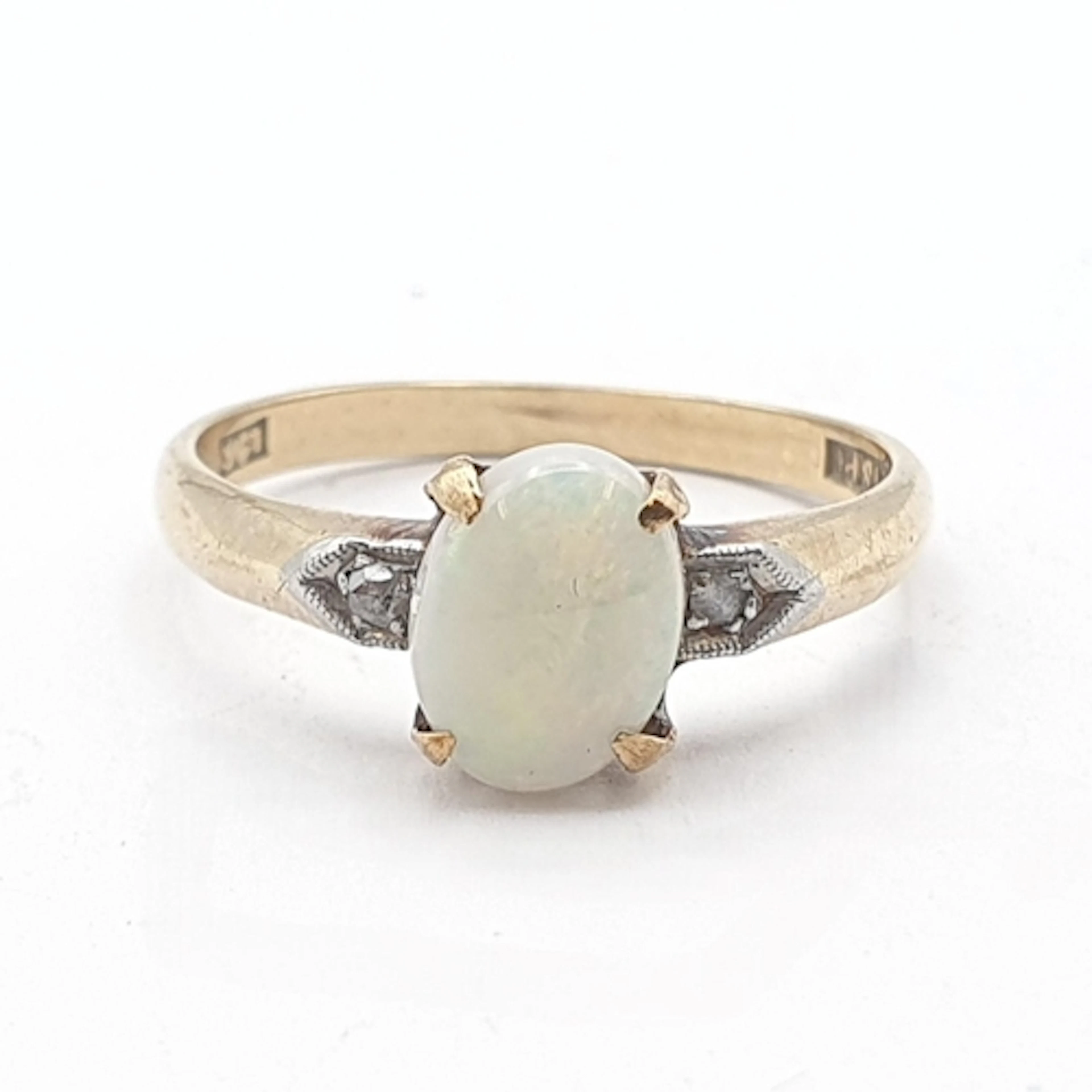 An Opal and Diamond Ring stamped 9ct, ring size M, approx 2....
