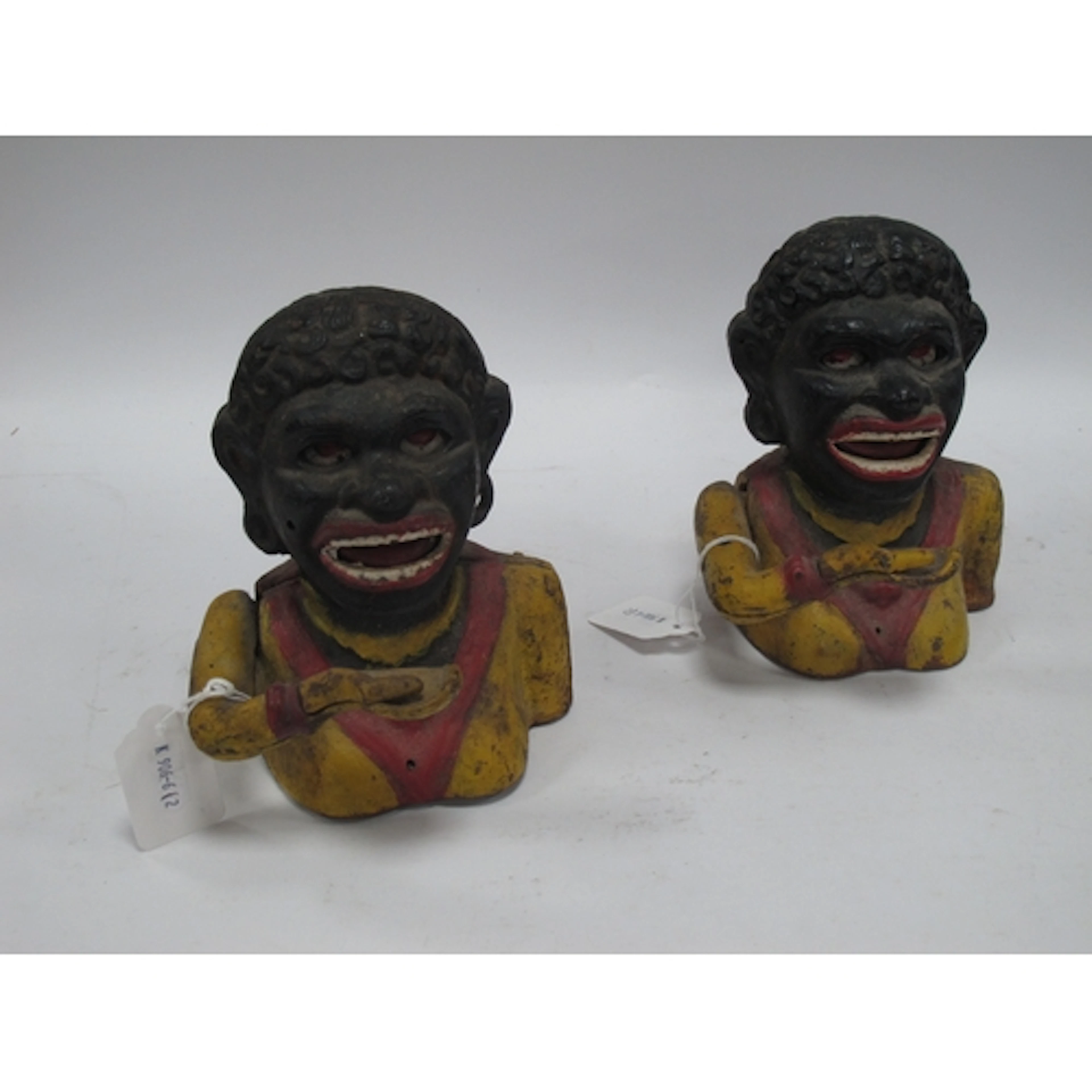 Two vintage painted "Dinah" cast iron mechanical money banks...