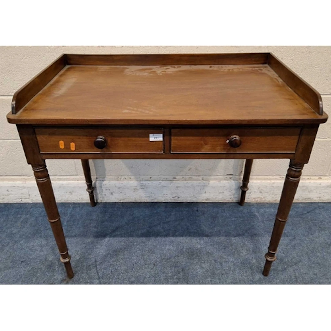 A 19TH CENTURY MAHOGANY WASHSTAND, with a raised back and si...