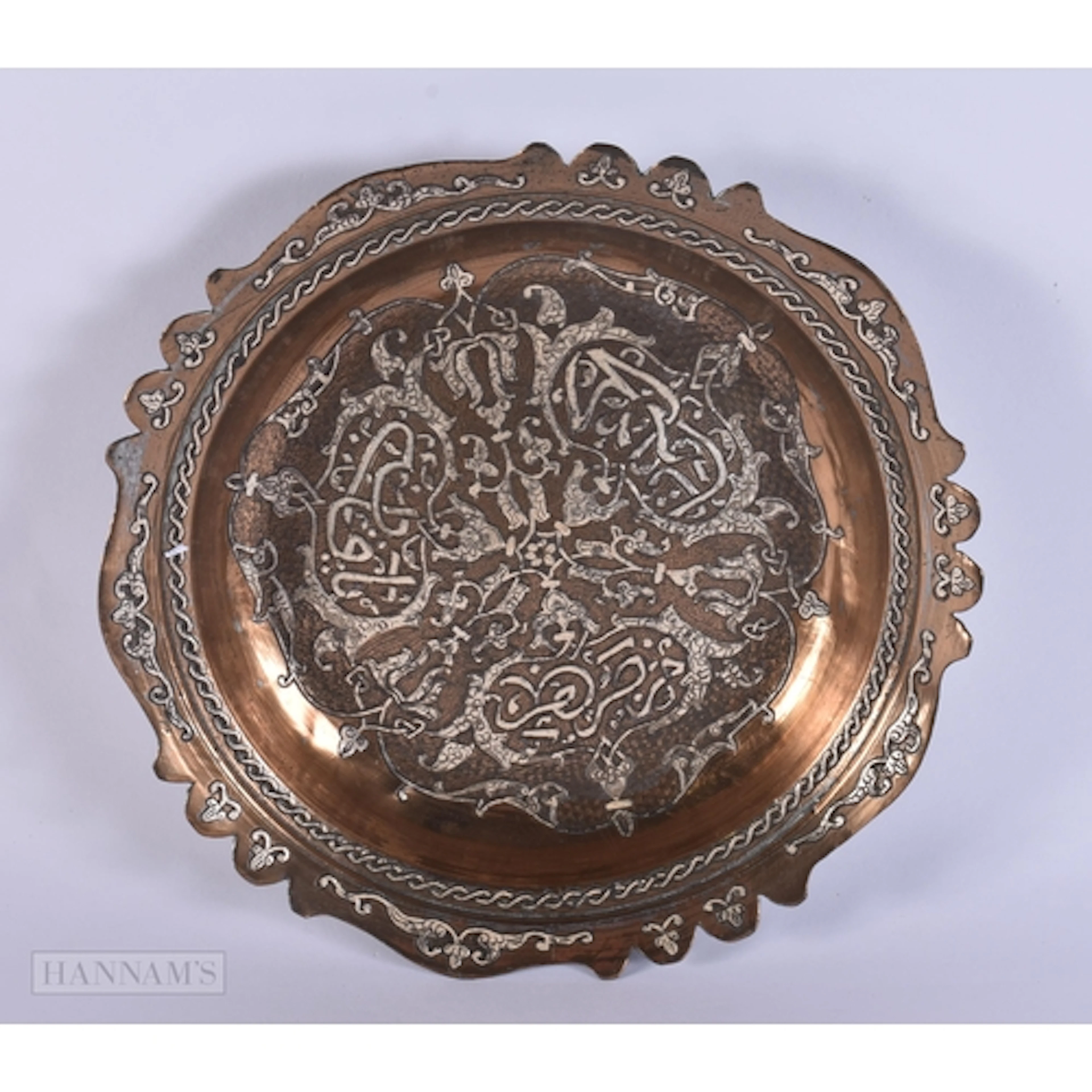 AN ANTIQUE ISLAMIC SILVER INLAID BRONZE DISH. 24.5 cm wide.