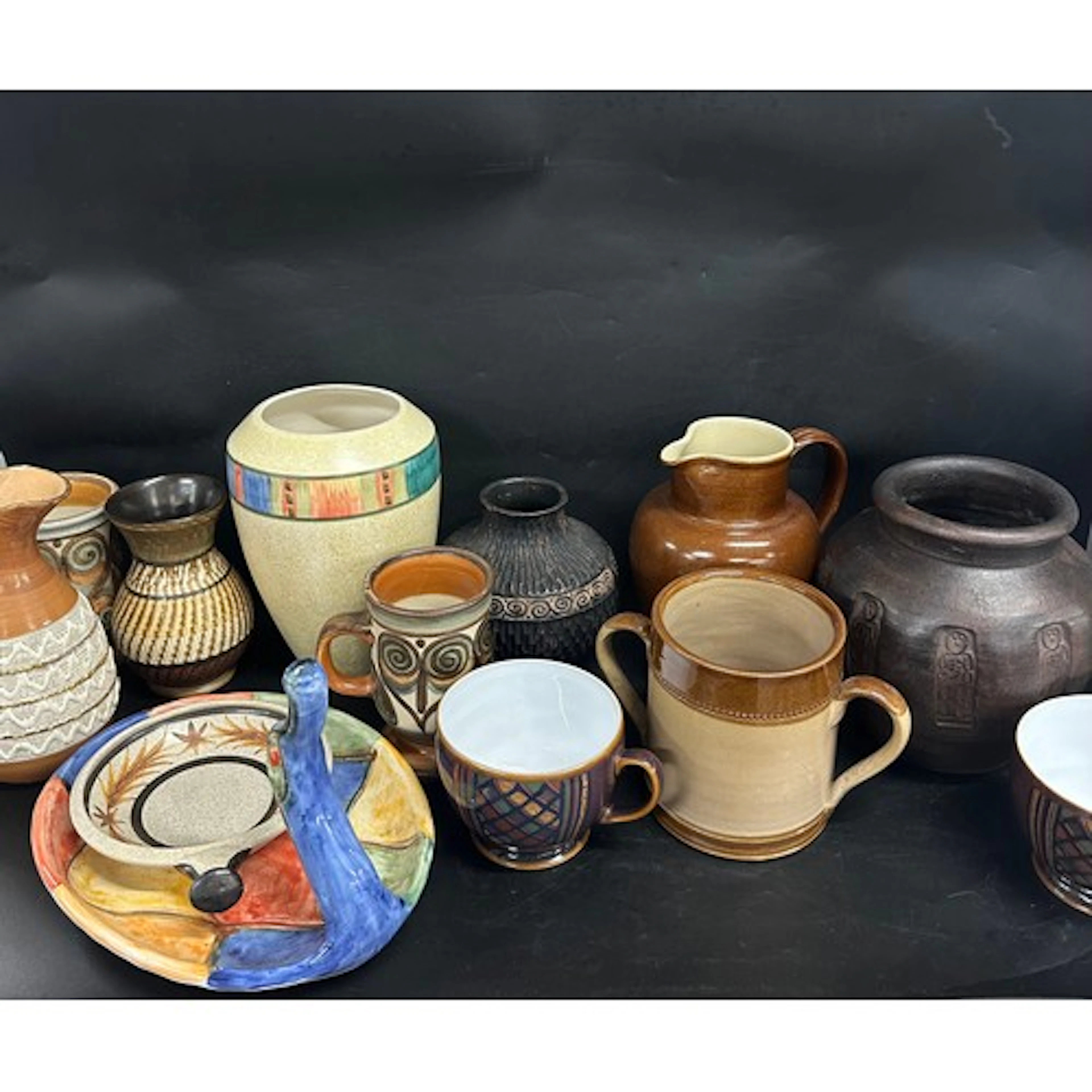 A collection of stoneware pottery to include Bretby, Denby, ...