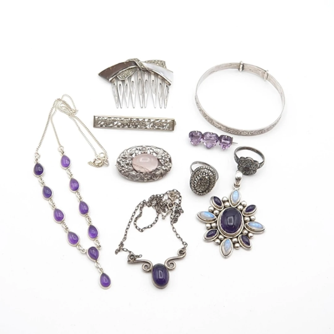 A Doug Pauls Pendant set moonstone and amethyst stamped 'DP9...