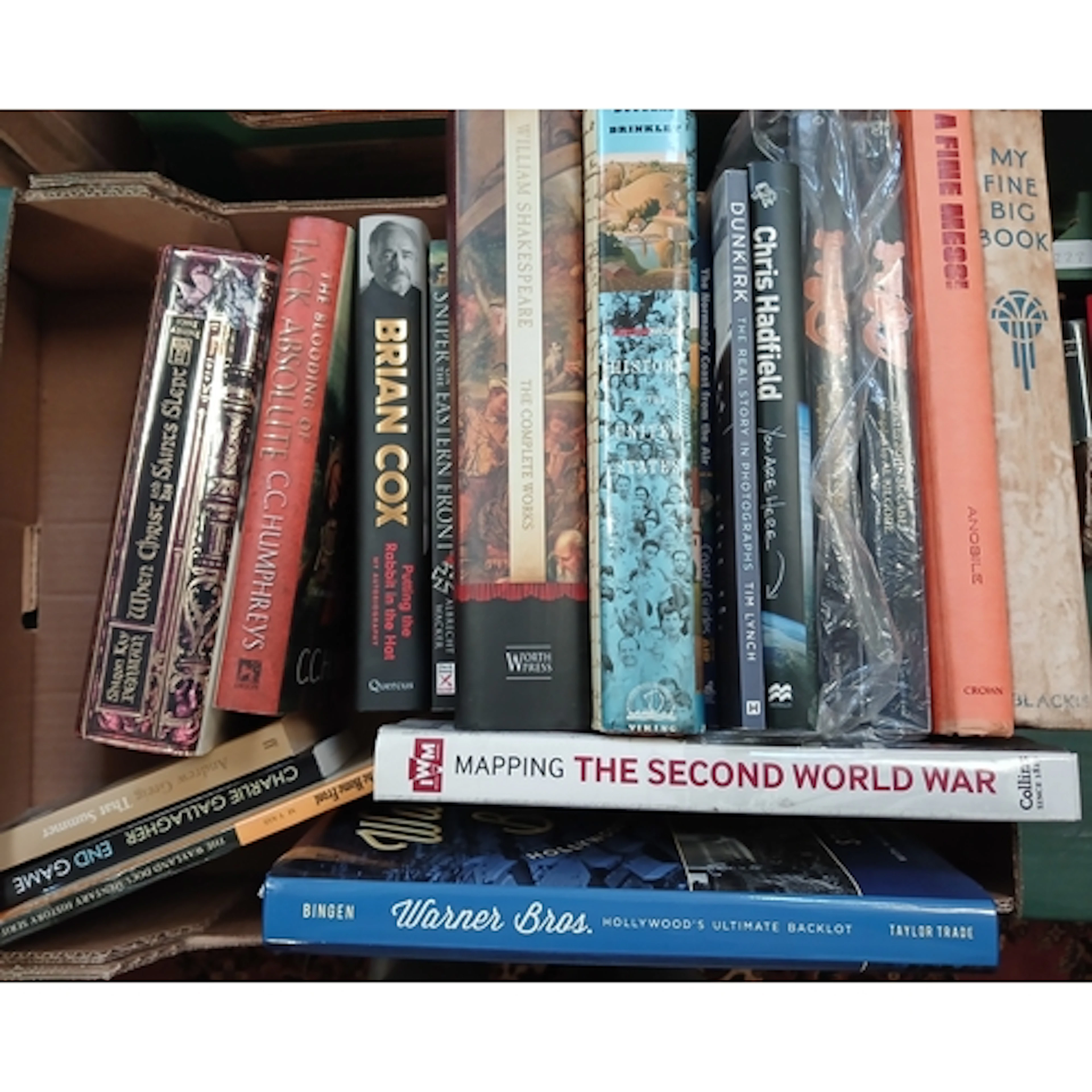 Nine boxes of assorted mainly hardback books, fiction and no...