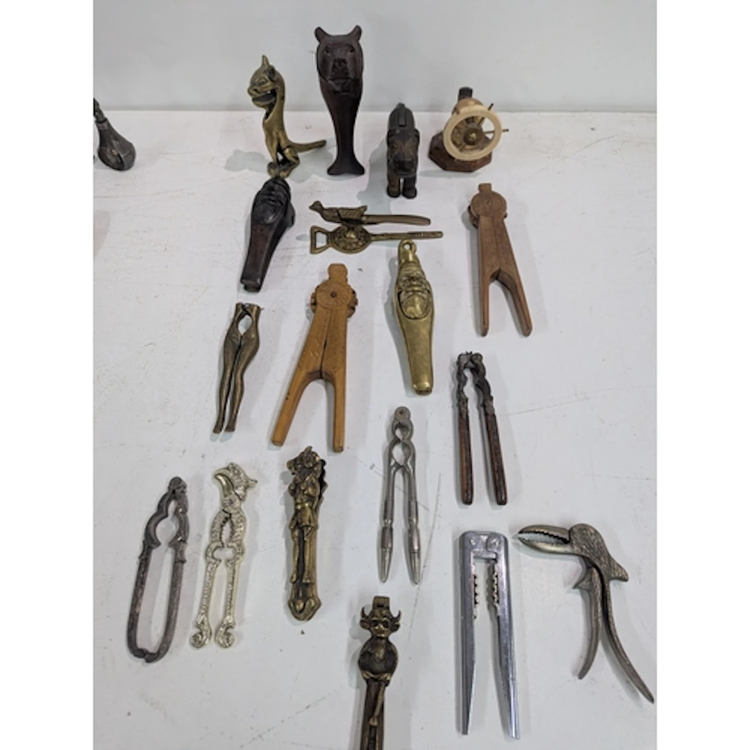 A collection of vintage nut crackers to include a wooden bea...