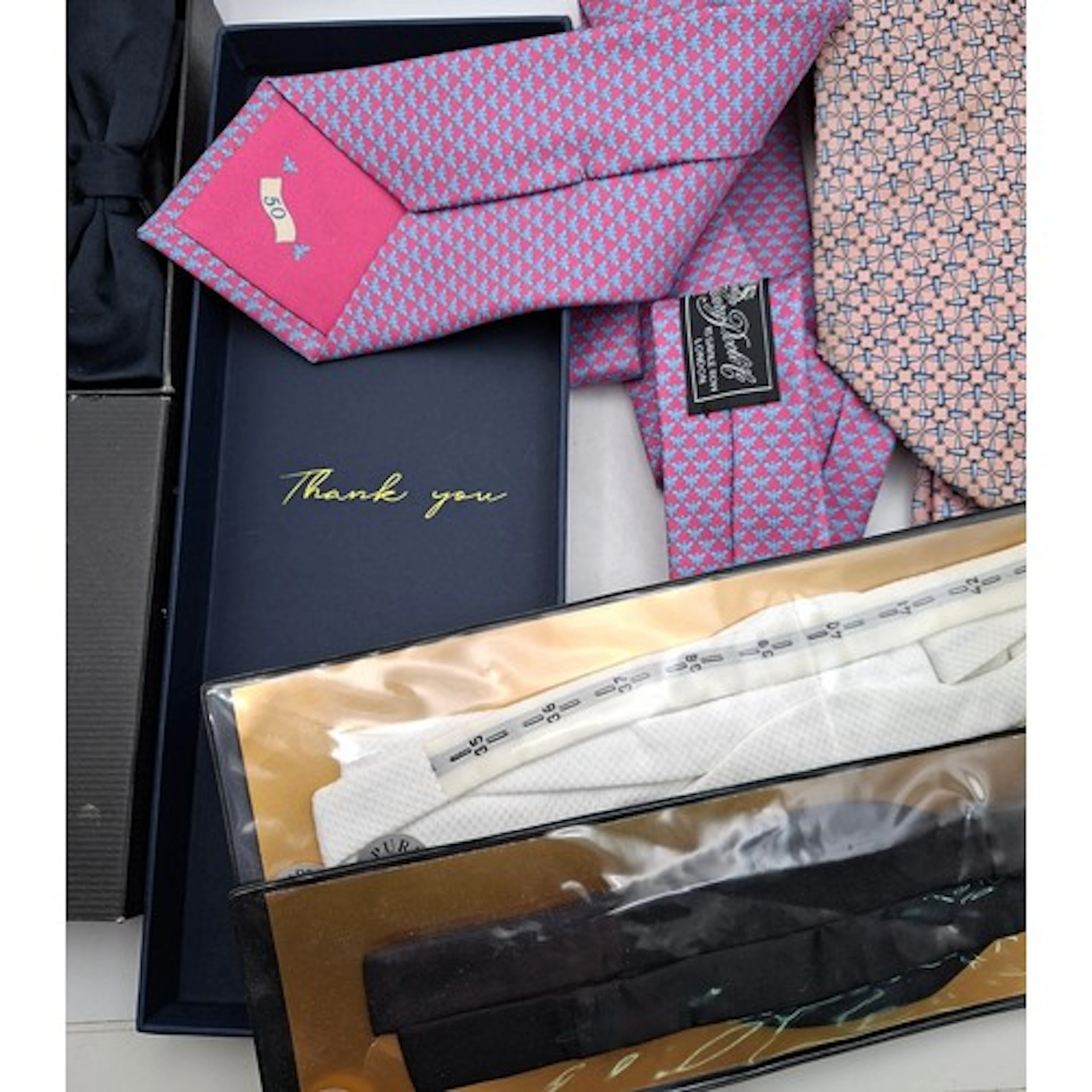 A boxed Coutts '50 Year Thank You' lilac and pink tie, a box...