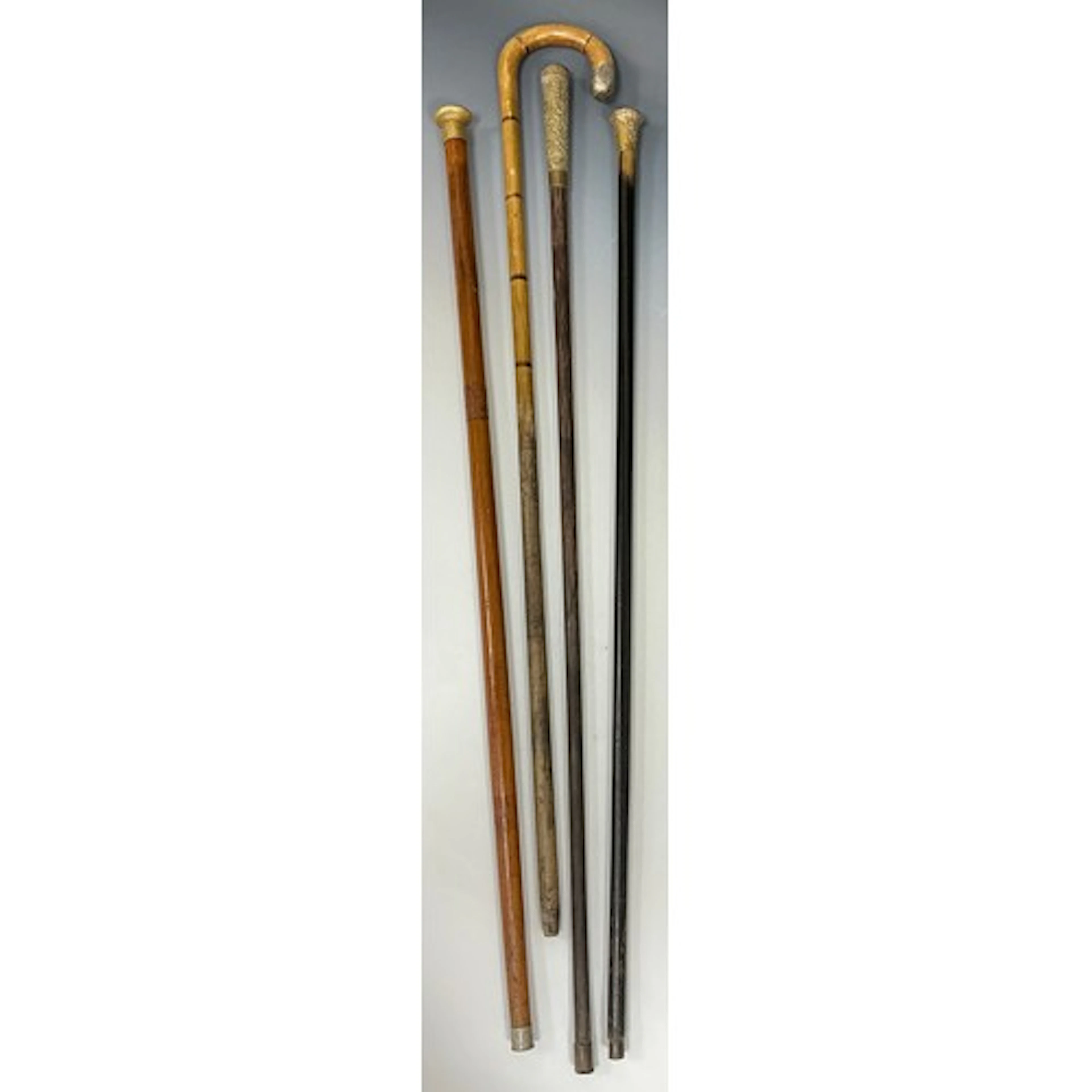 A Victorian 18ct gold plated walking stick, the domed pommel...