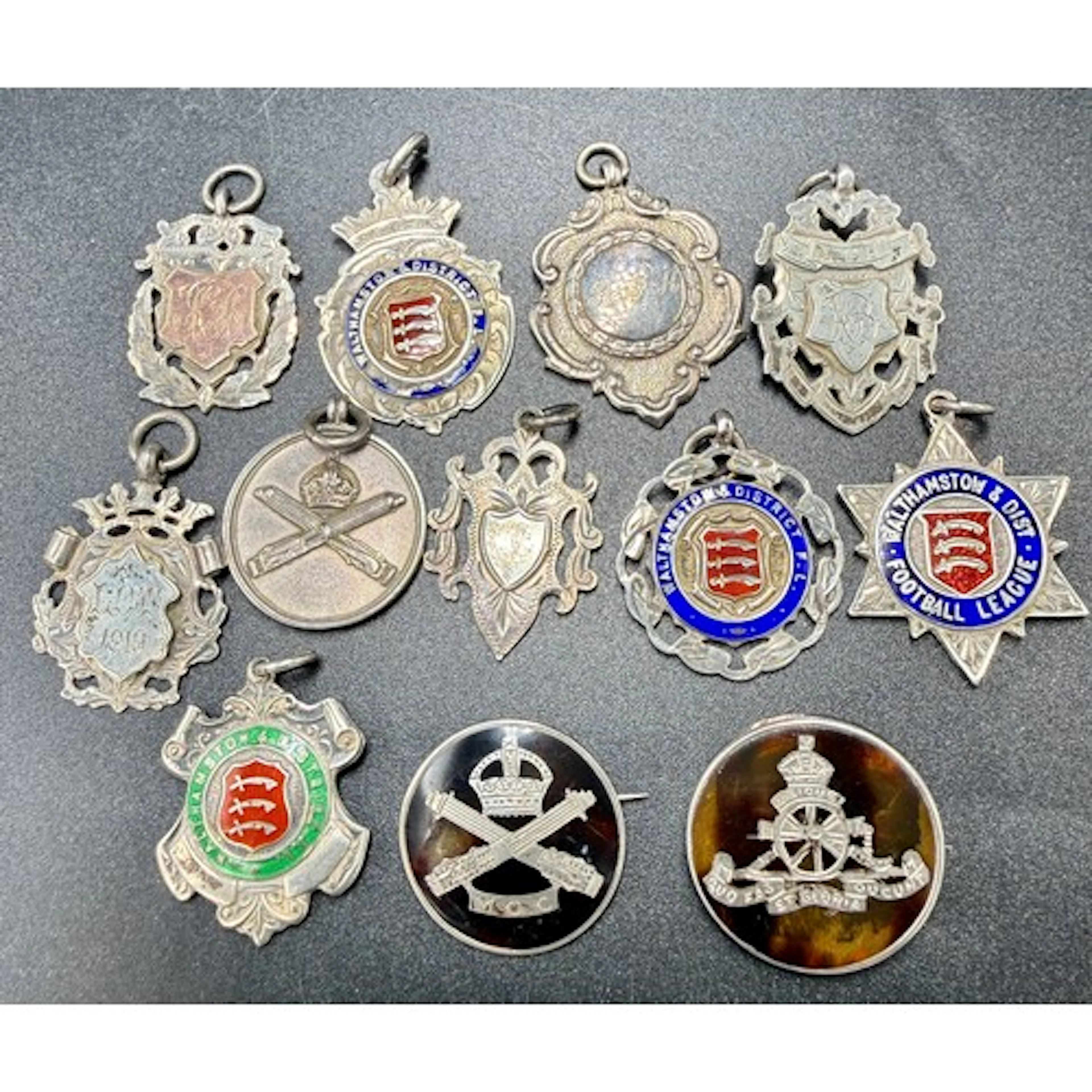 A quantity of silver, enamel and tortoiseshell badges and fo...