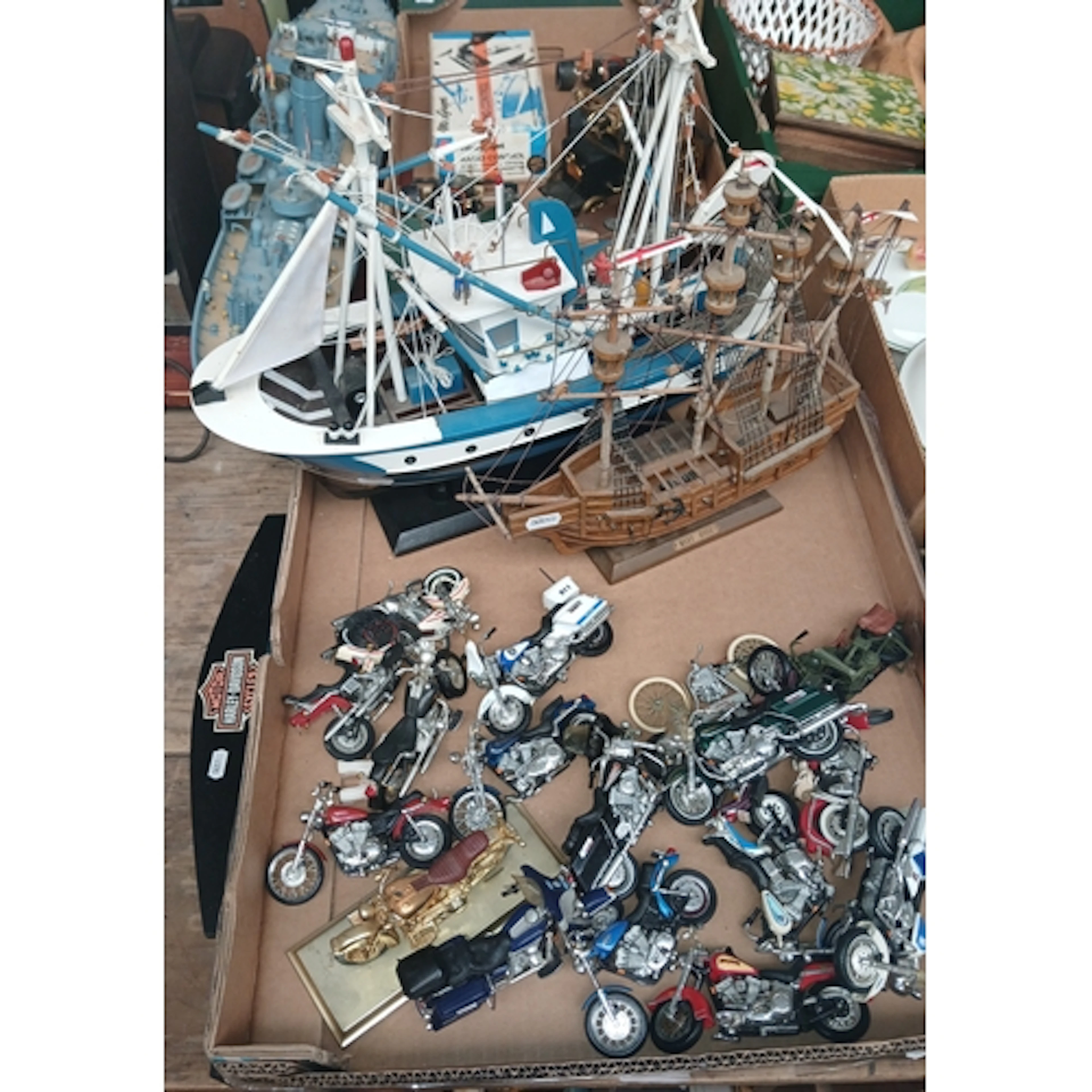 A Harley Davidson display stand with 18 motor cycles & 2 mod...