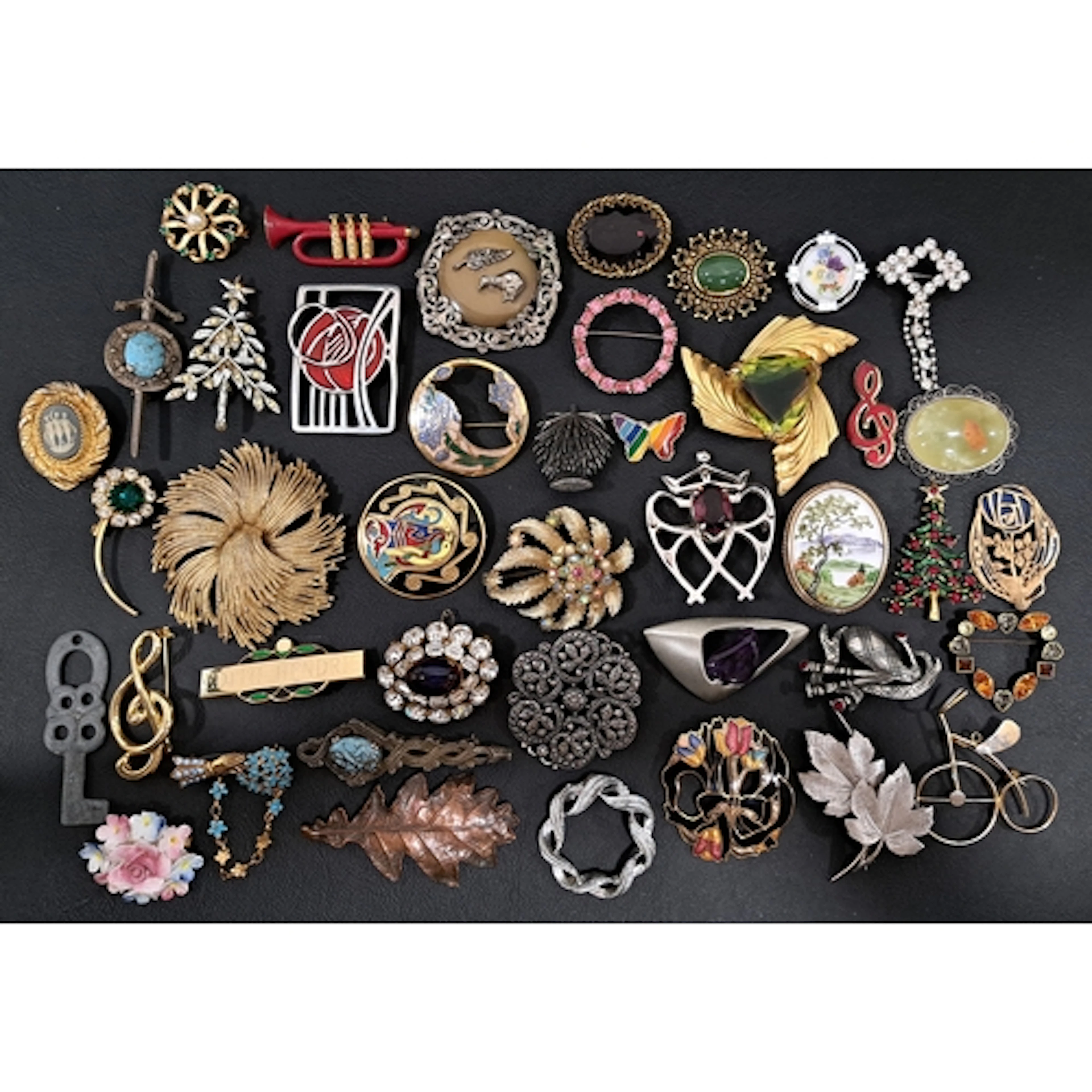 FORTY-TWO VINTAGE BROOCHES including stone, paste, and clois...
