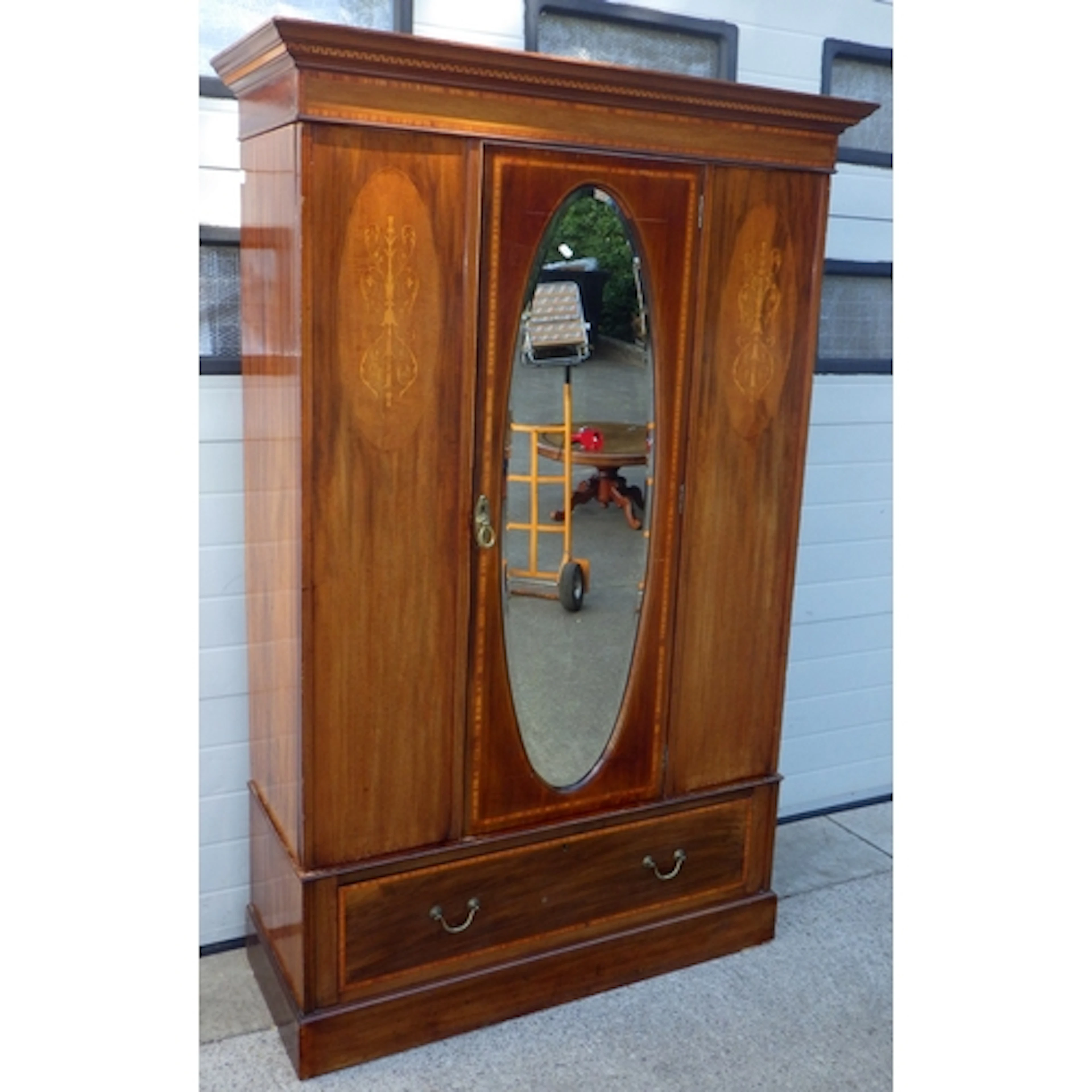 An Edwardian mahogany single door wardrobe, 131cm wide, 204c...