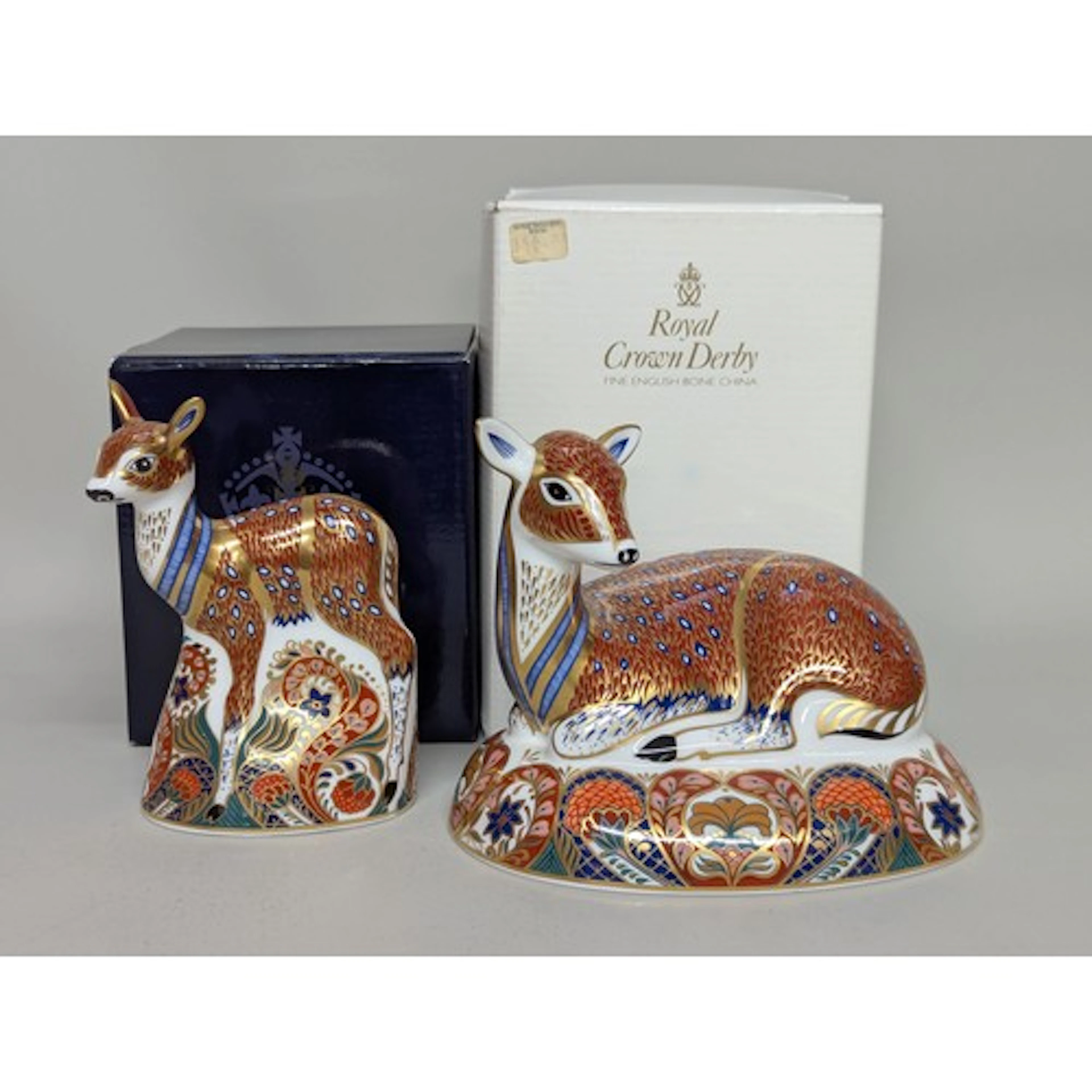 A pair of Royal Crown Derby paperweights, comprising Roe Dee...