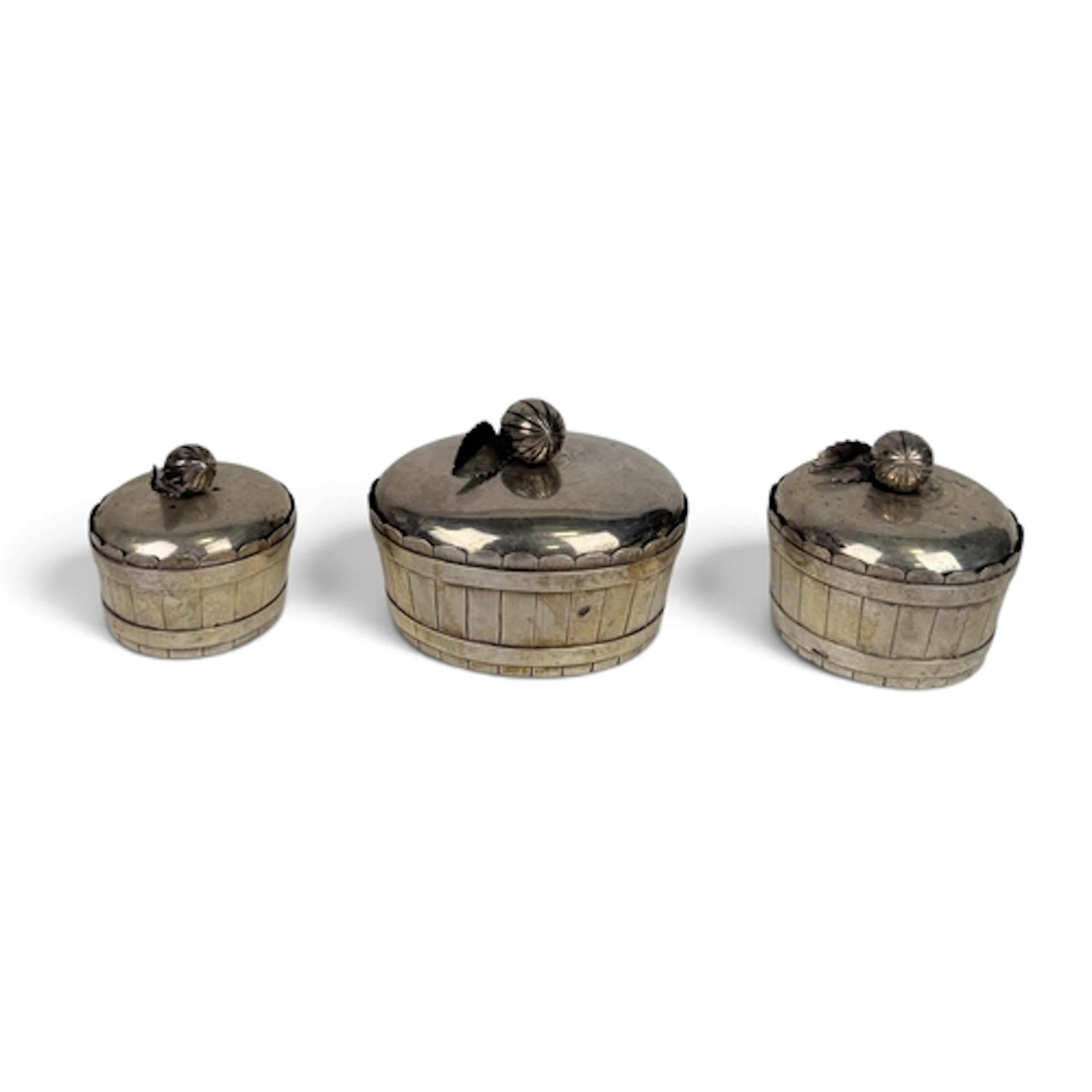 THREE MATCHED 19TH C THAI SILVER BETEL BOXES Each shaped as ...