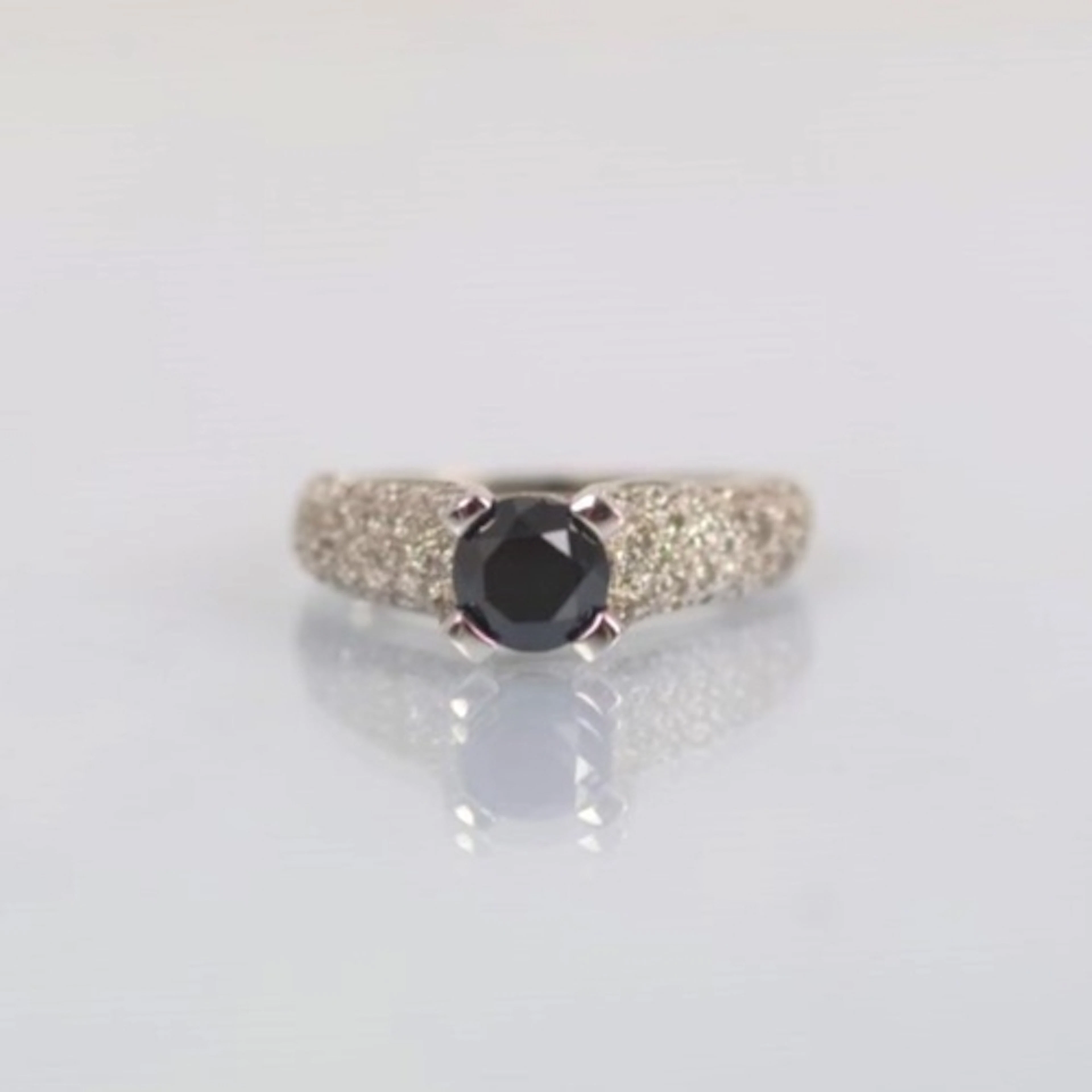 A contemporary 9ct white gold dress ring, the black diamond ...