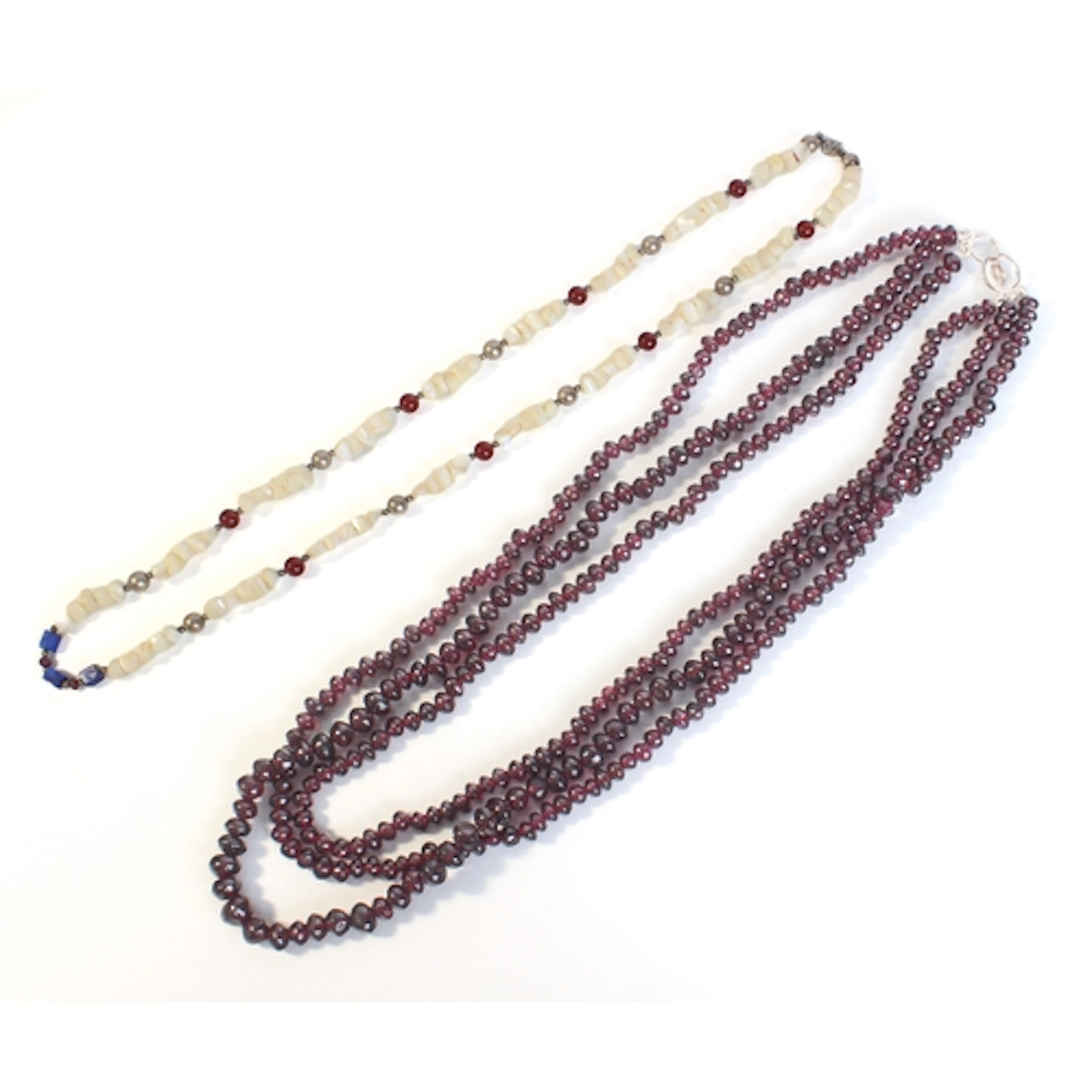 A three-strand garnet bead necklace - with sterling silver h...