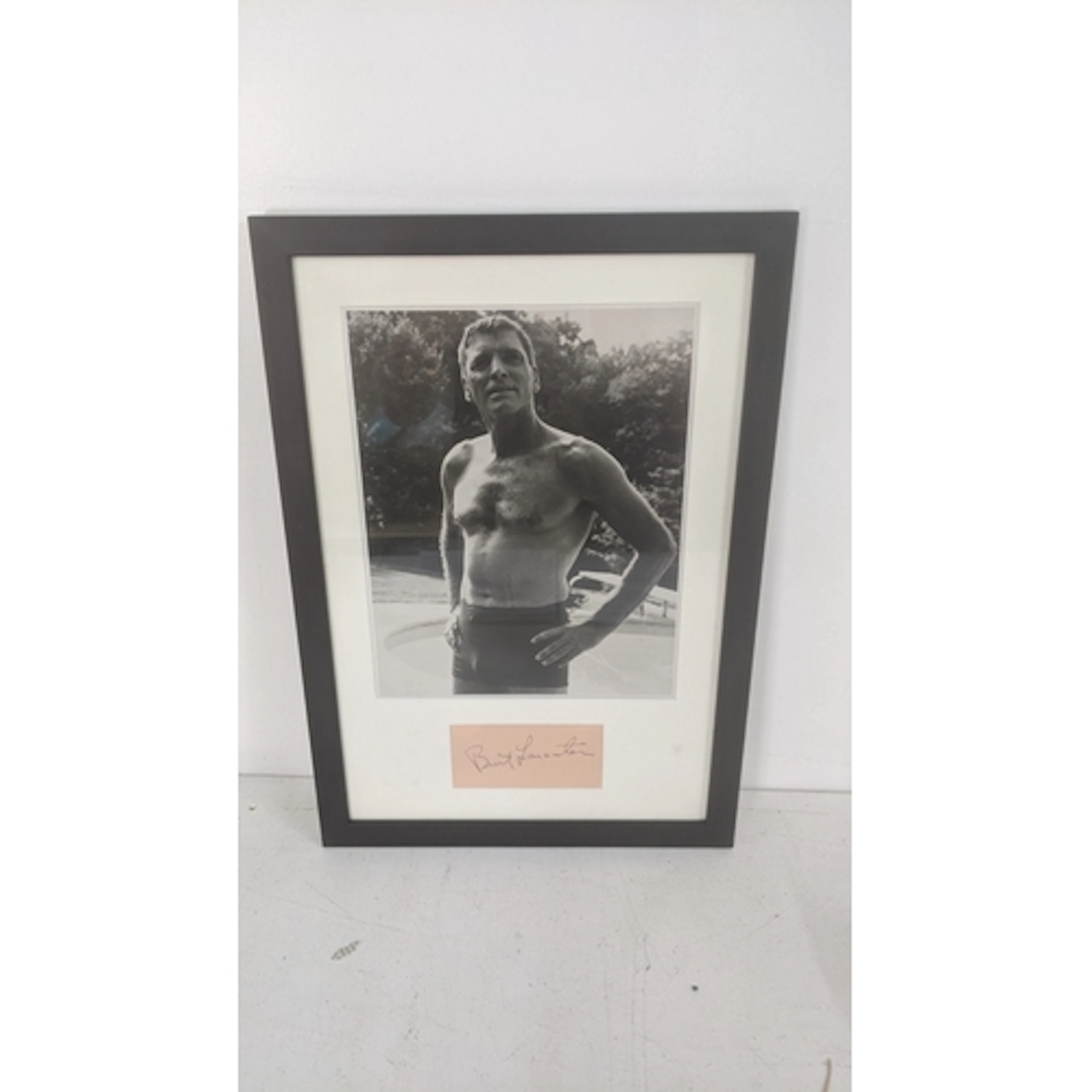 A framed and glazed black and white photograph and associate...