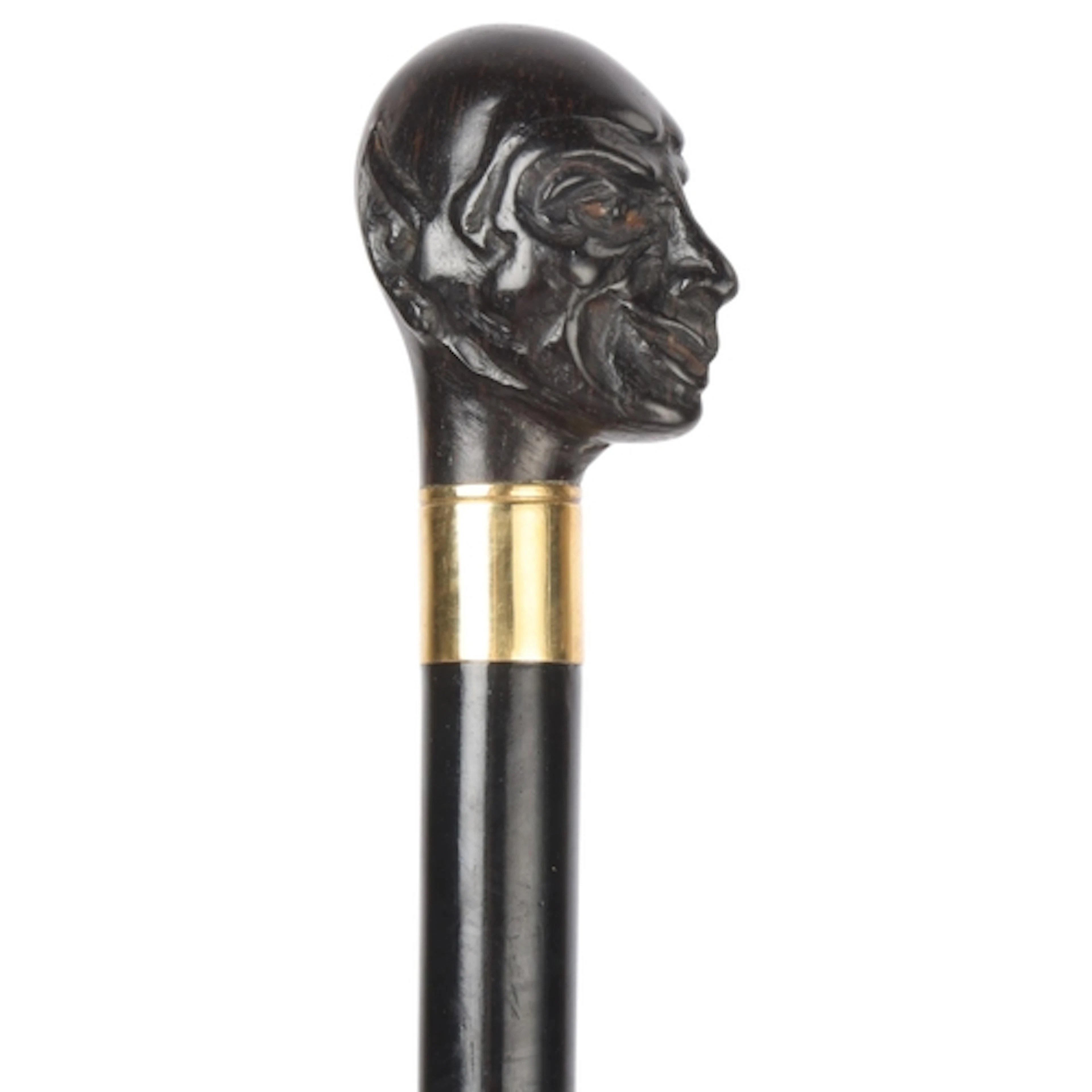 An antique Mephisto-handled cane, the ebony handle finely ca...
