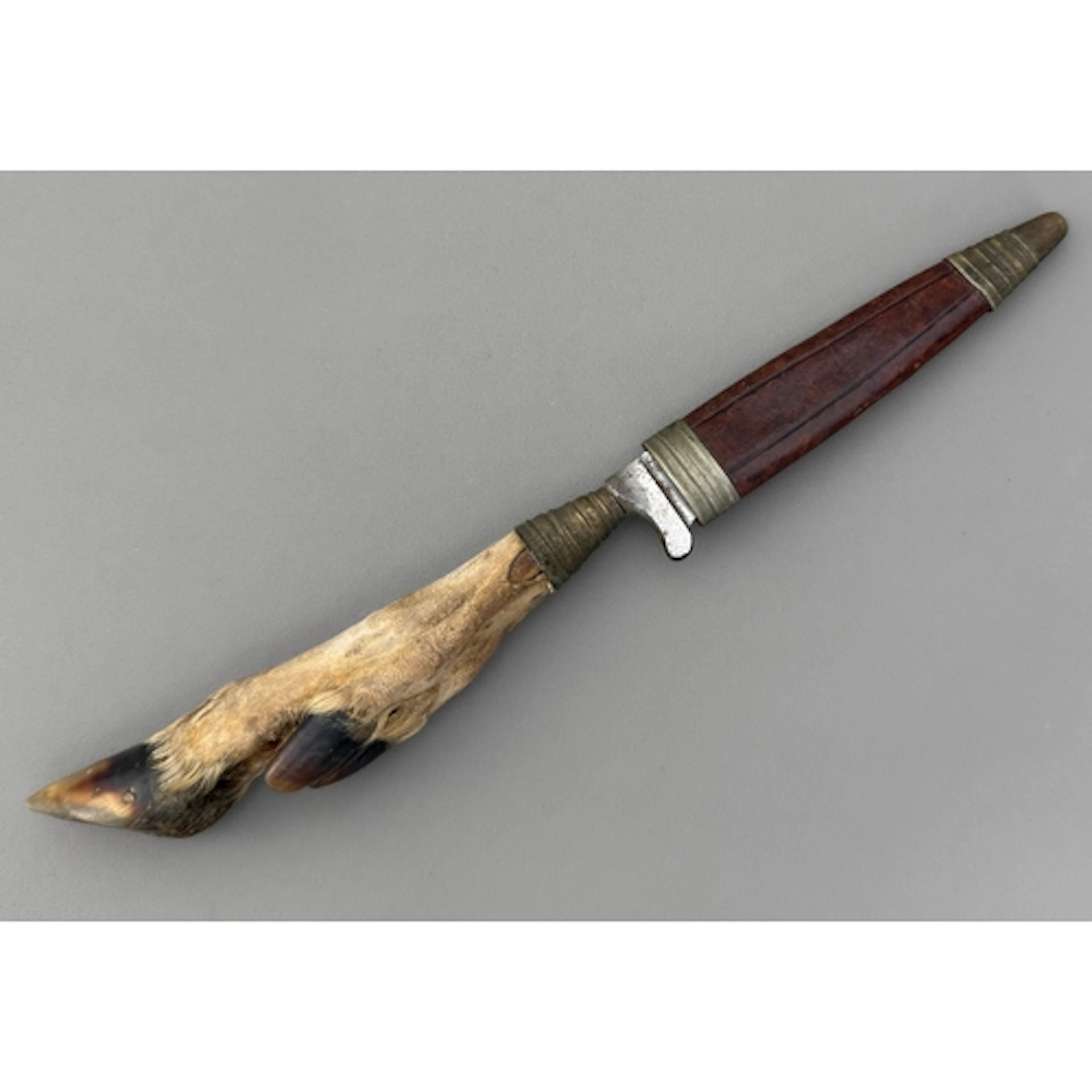 A twentieth century German hunting knife - with deer foot hi...