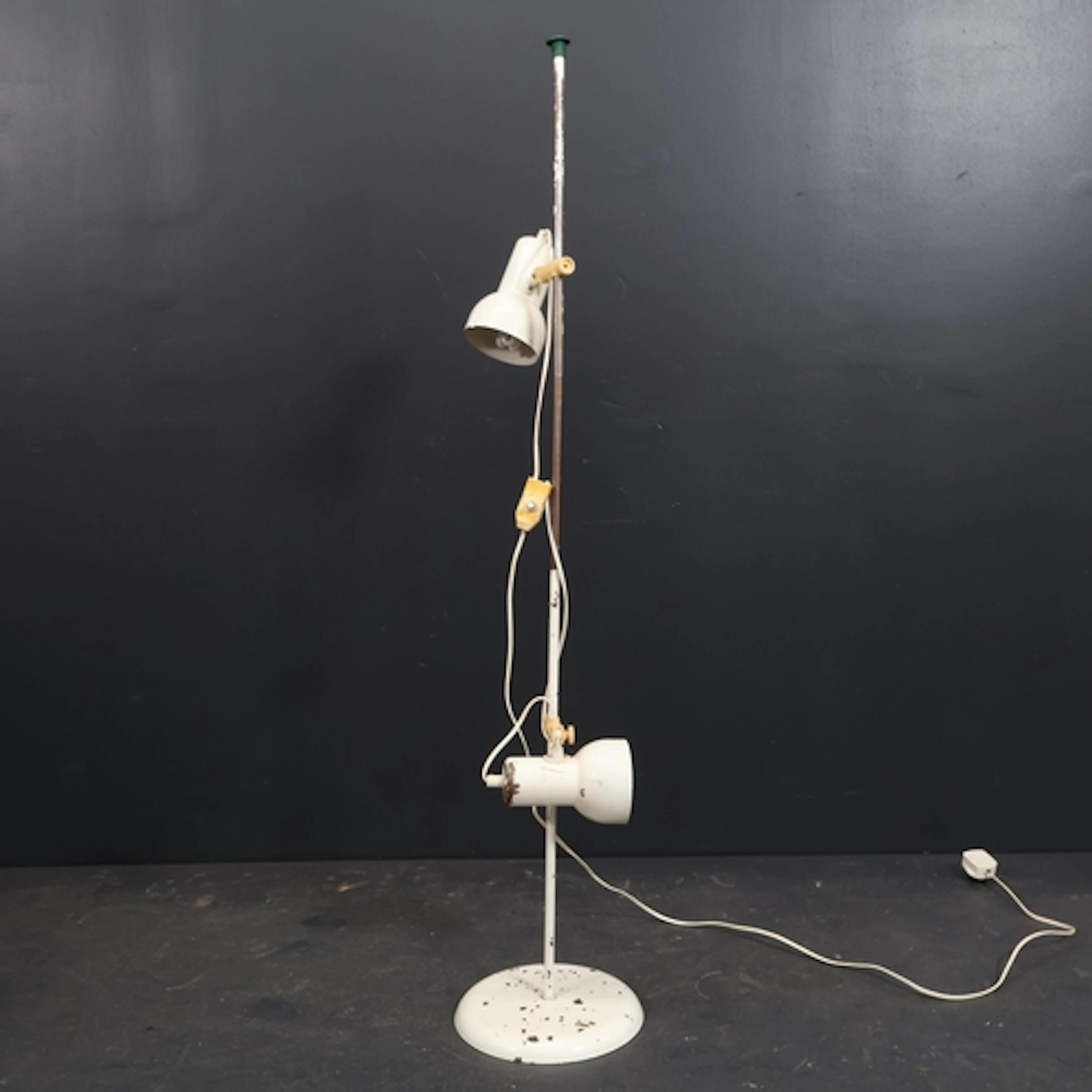 A Danish 1970's adjustable dual head floor lamp in the manne...