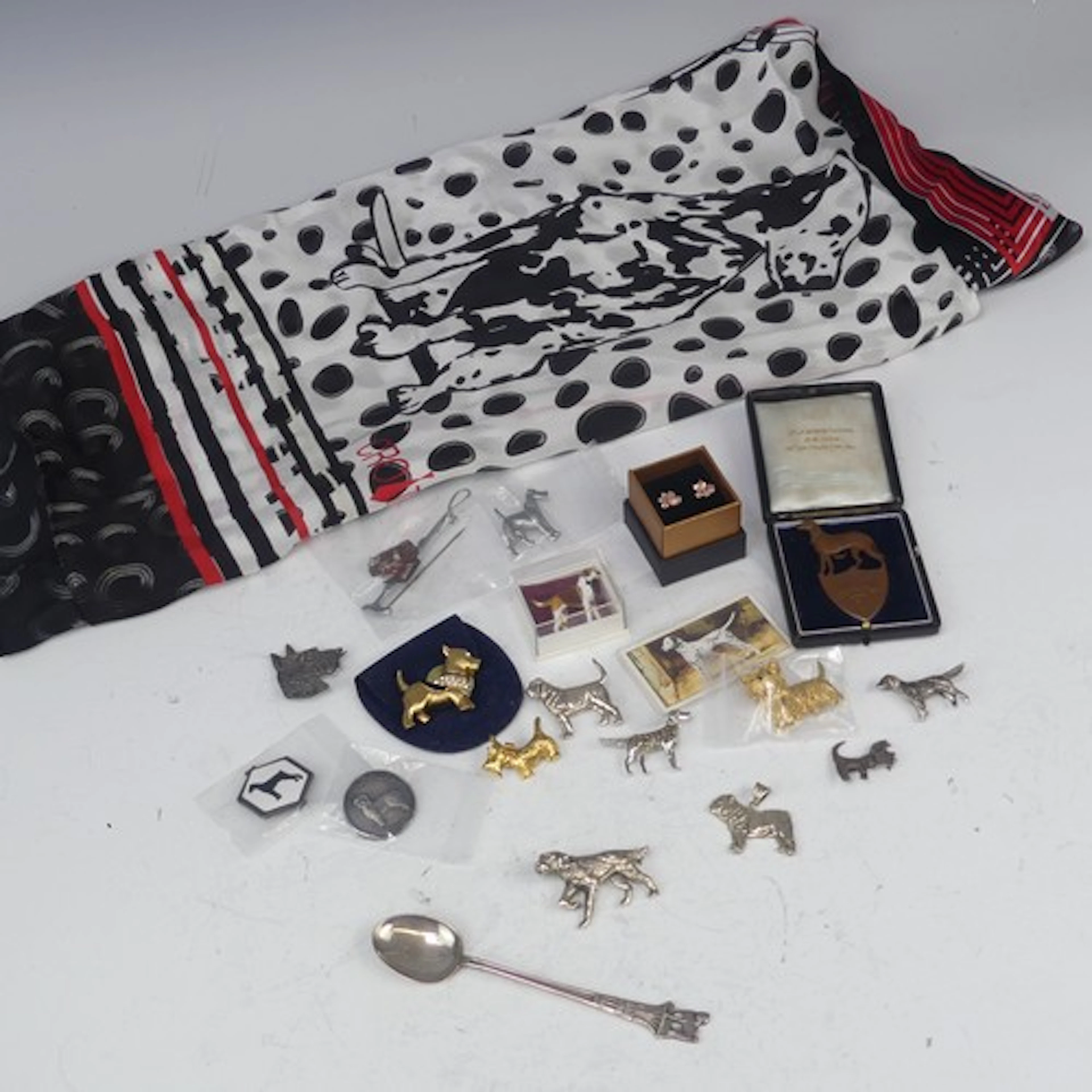 Four silver Dog Brooches, two set marcasite, together with a...