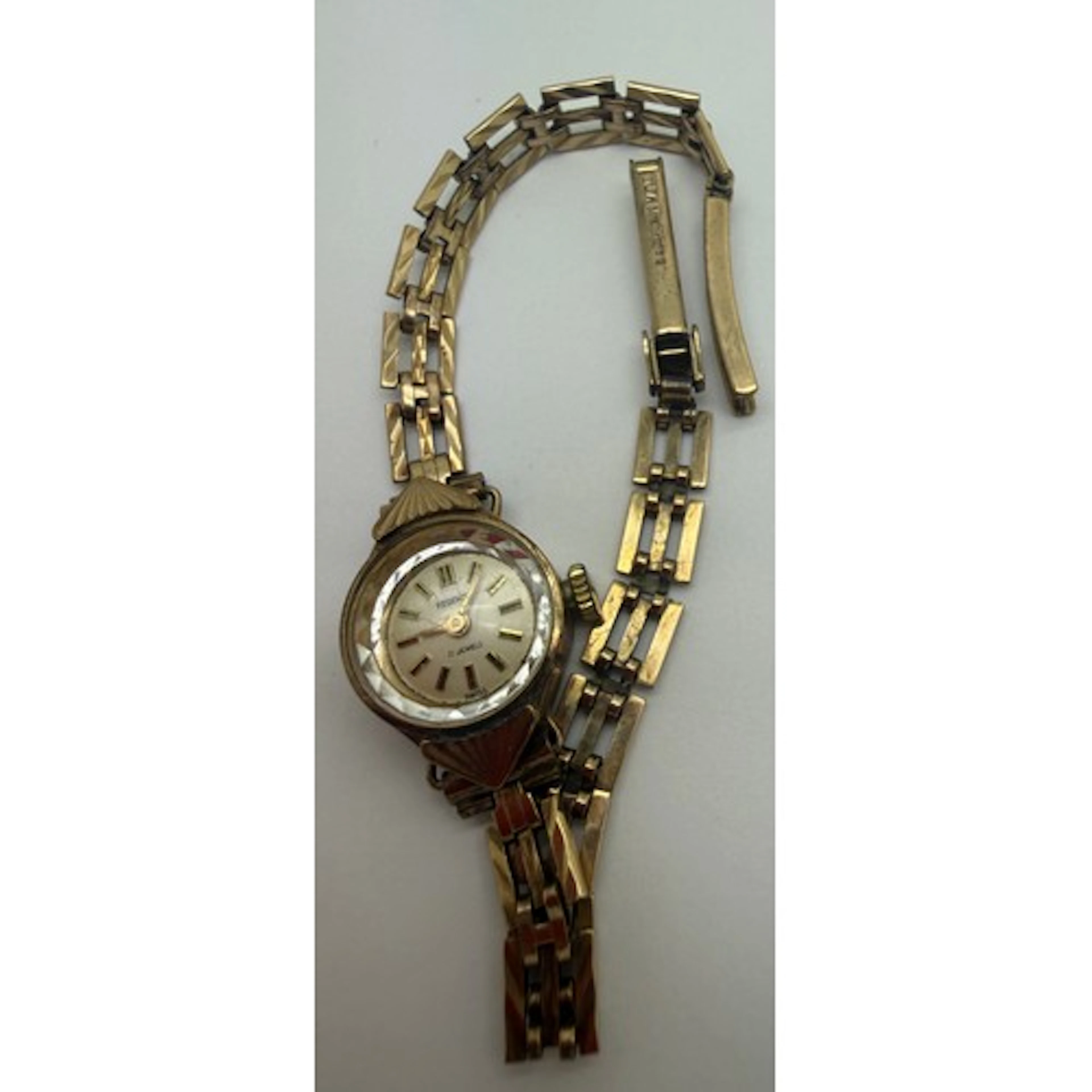 A 9 carat gold cased Regency ladies wristwatch on a 9 carat ...