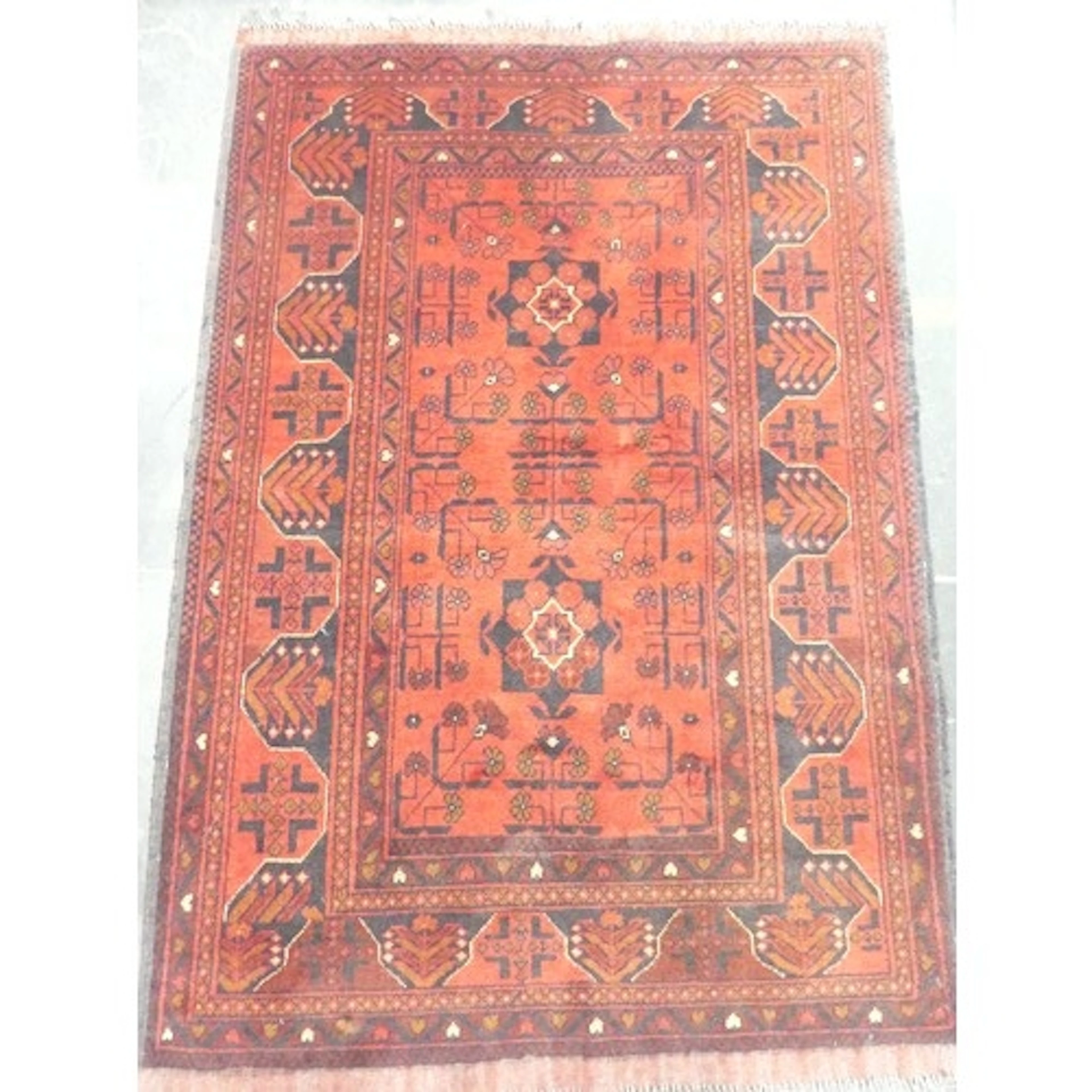 Tribal Rugs; a tightly hand-knotted red ground Afghan rug, 1...