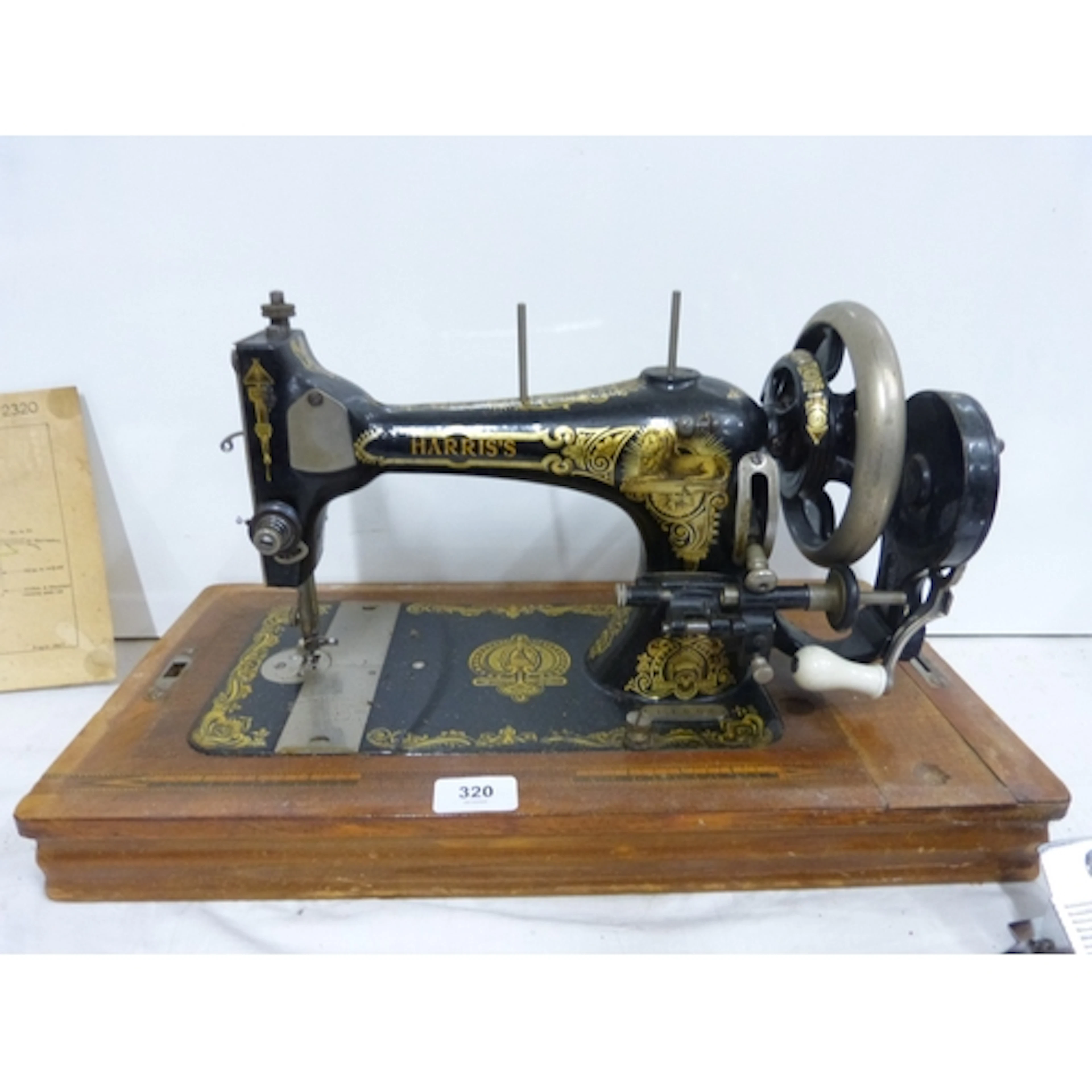 Antique Harris's German made sewing machine, cased circa 191...