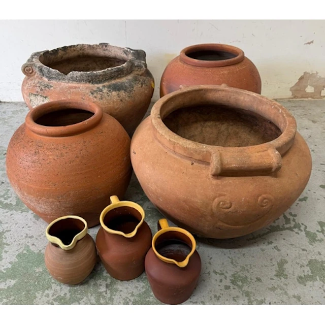 A selection of terracotta pots and jugs. Various sizes and c...