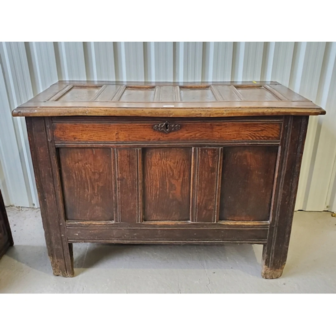 A 17th Century joined oak three panel Coffer with sunken fou...