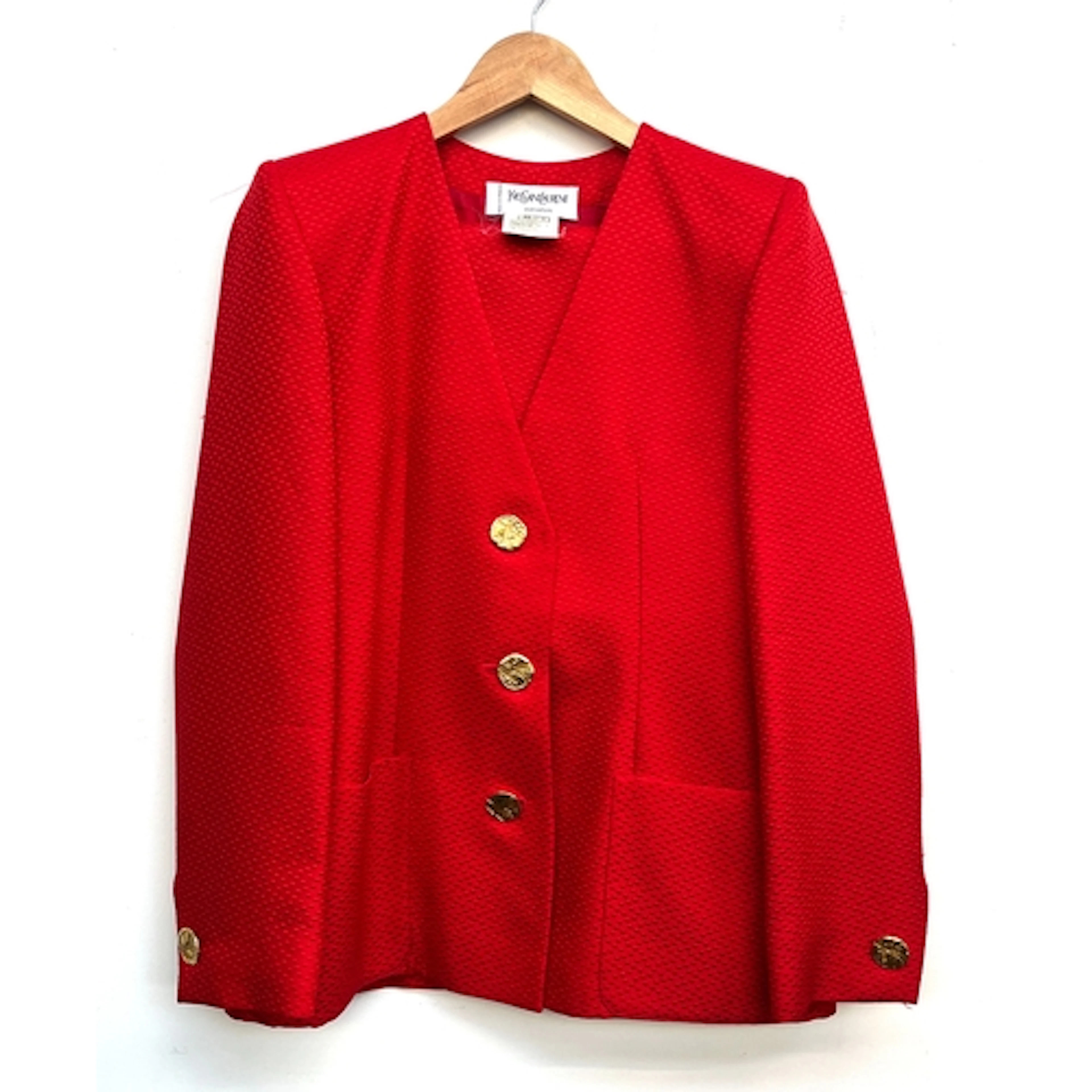 A Yves Saint Laurent red cotton silk blend jacket with gilt ...