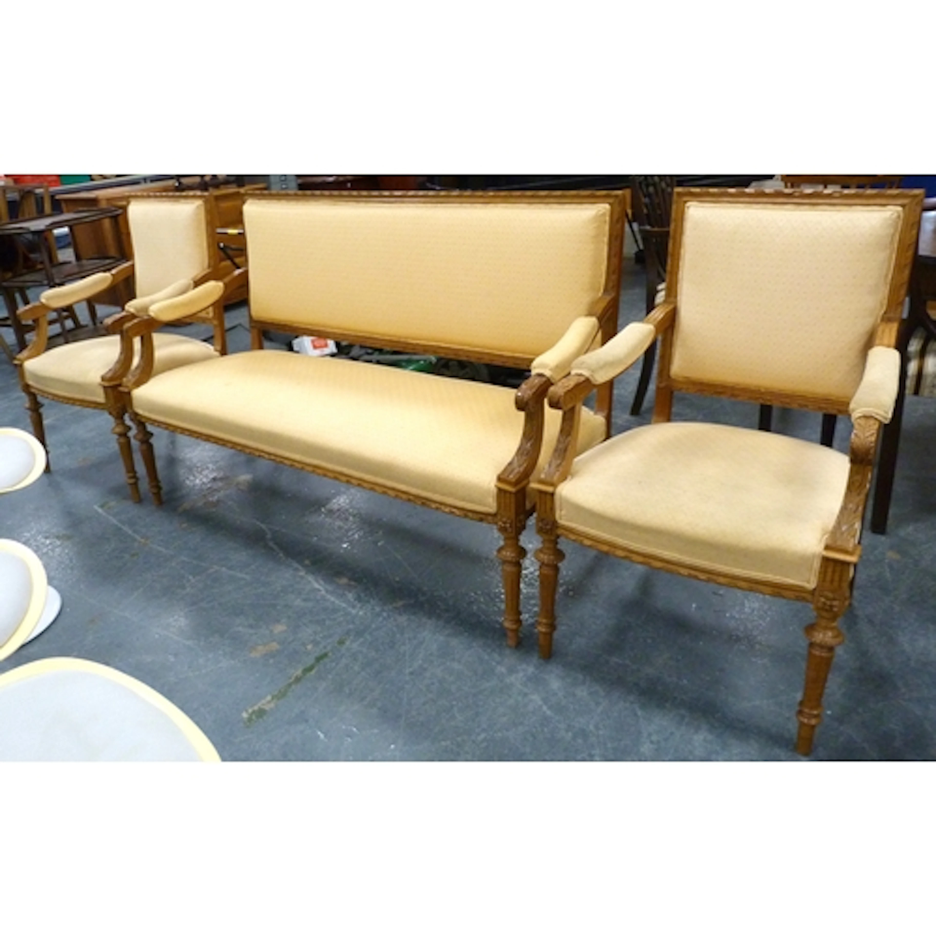 Three piece carved salon suite comprising of open arm sofa a...