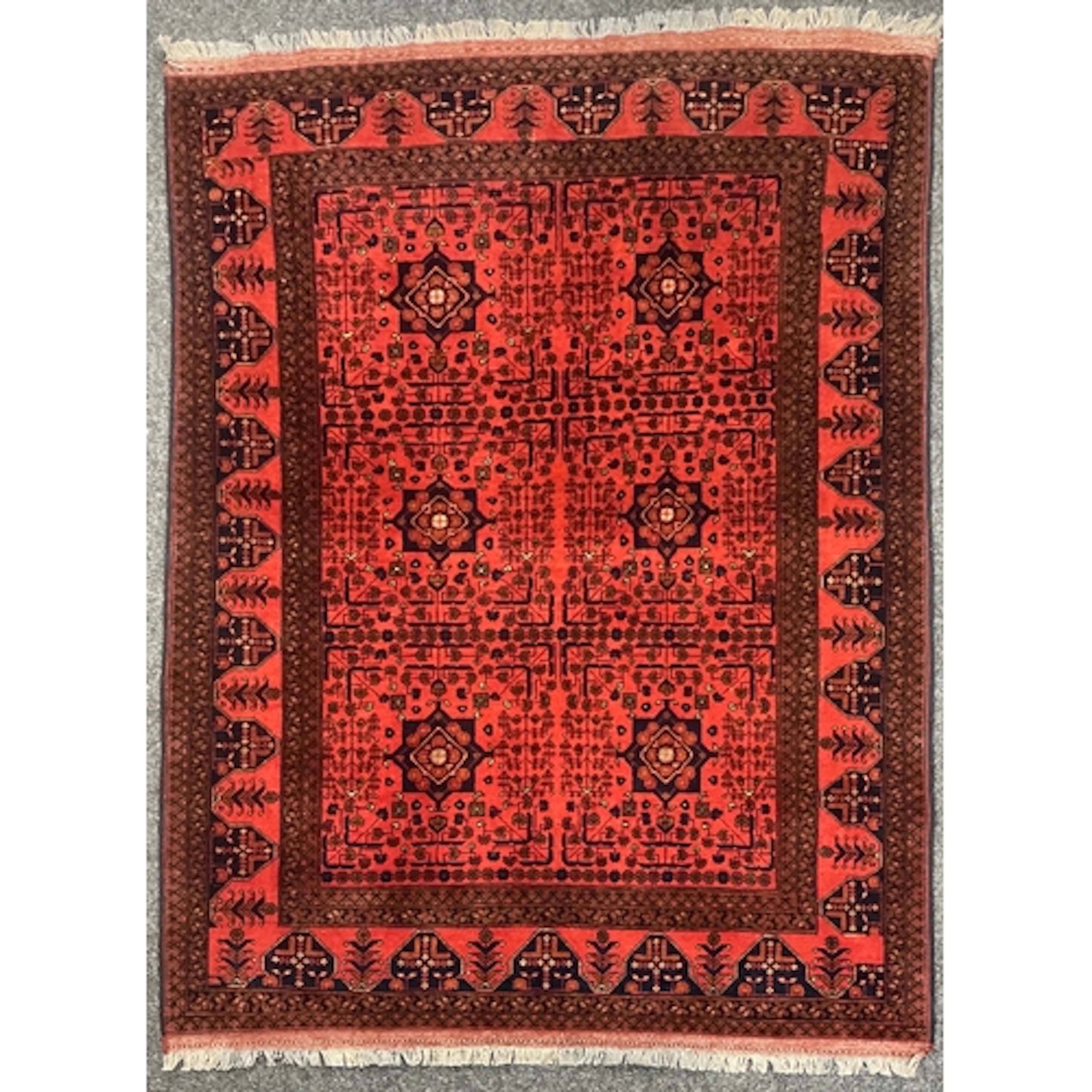 A Middle Eastern Bukhara rug or carpet, the rectangular fiel...
