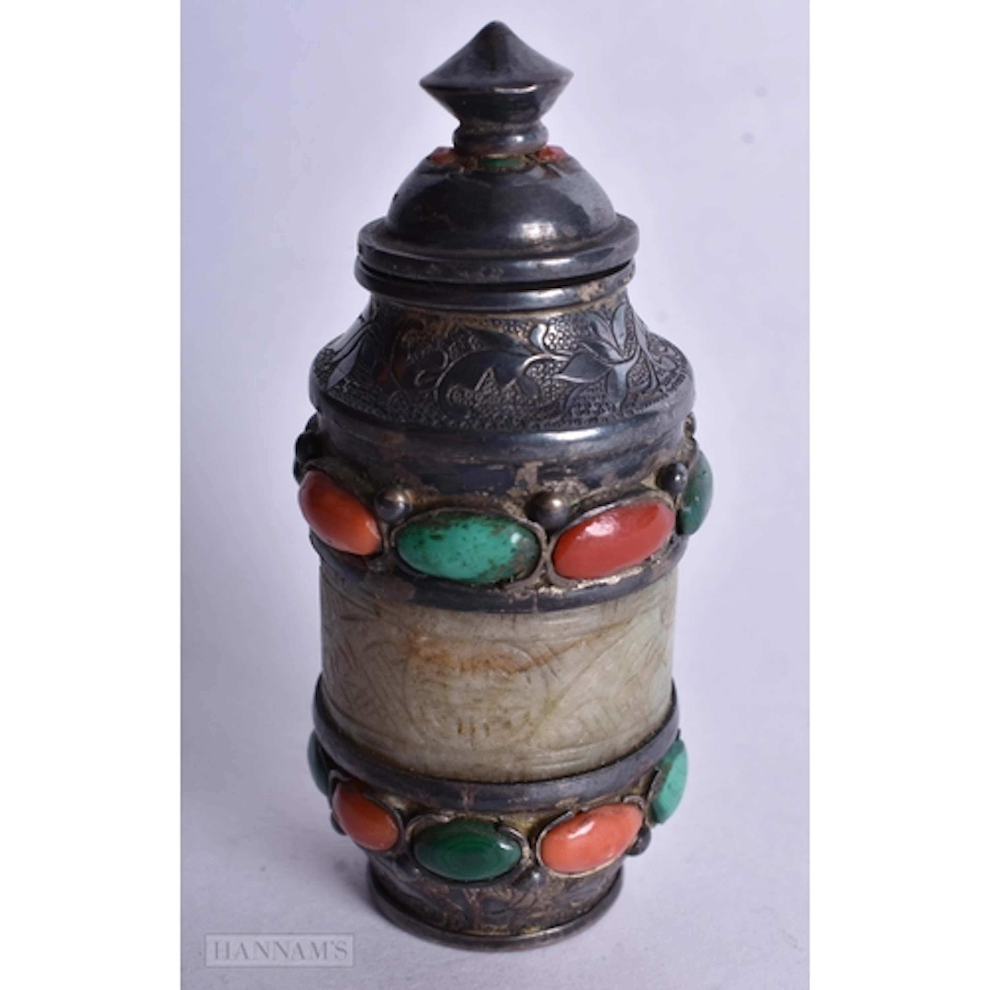 A SILVER AND JADE SNUFF BOTTLE FORMED WITH AN ARCHERS RING. ...