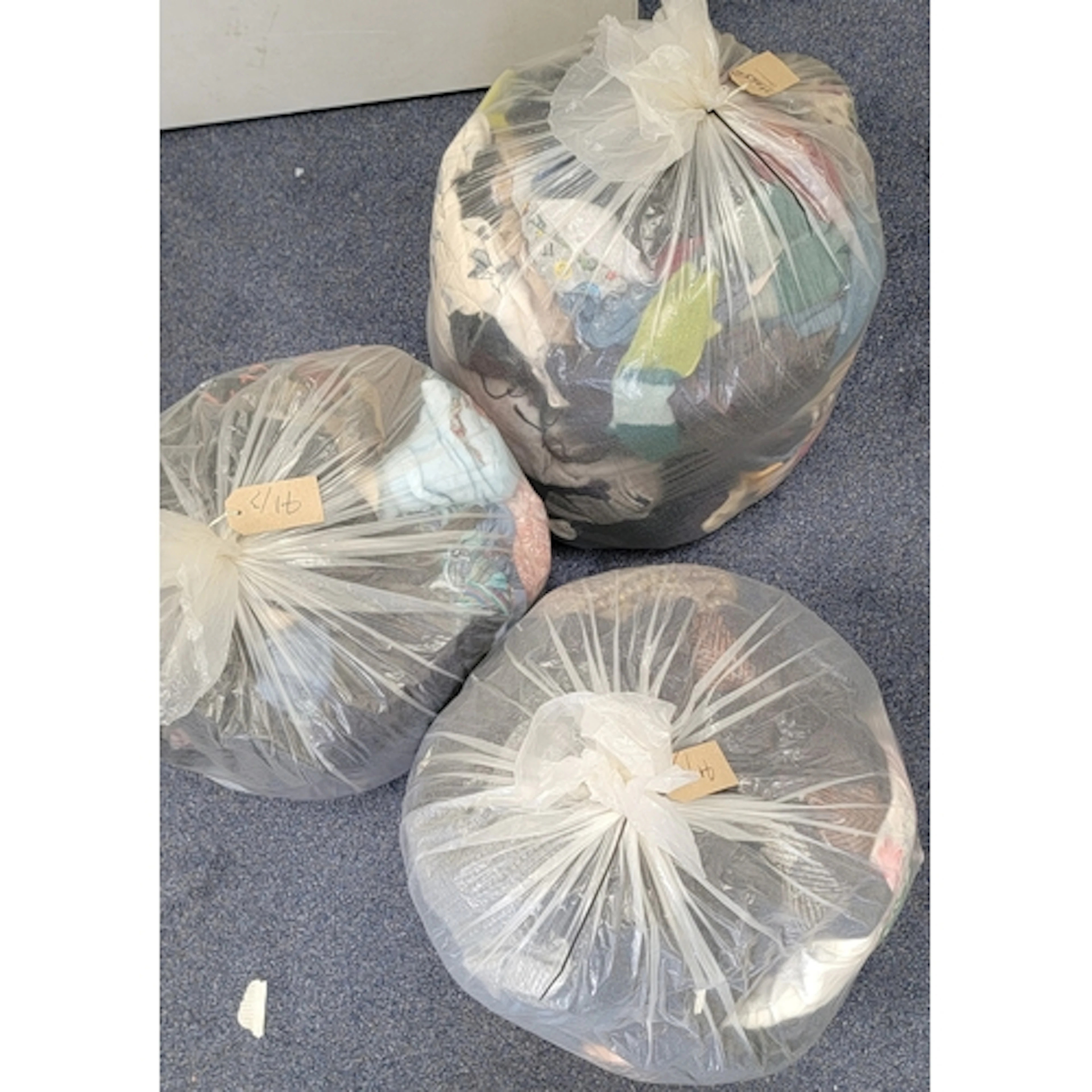 THREE BAGS OF HATS, SCARVES AND GLOVES including Barbour, Pu...