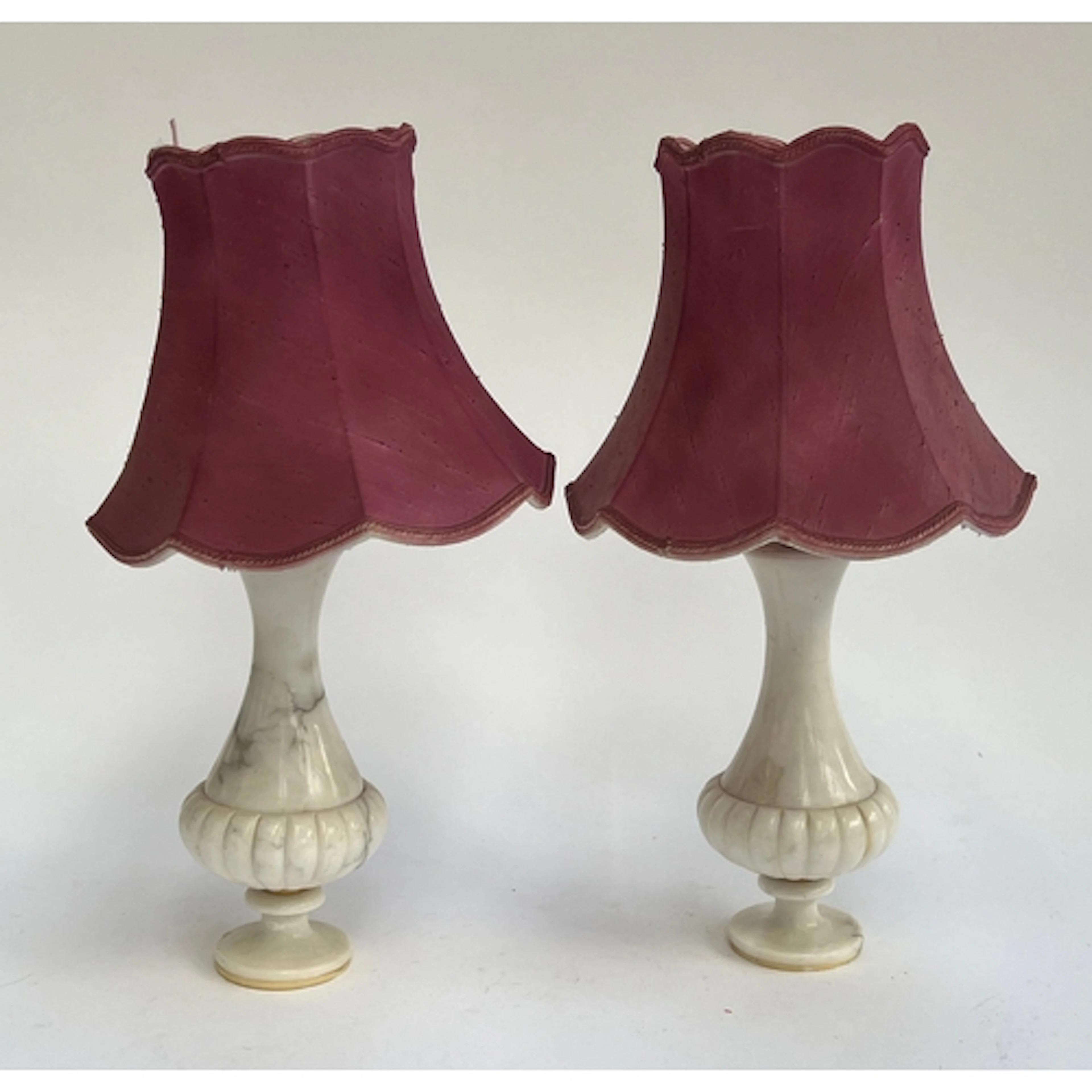 A pair of alabaster table lamps with pink shades, each 25cmH...