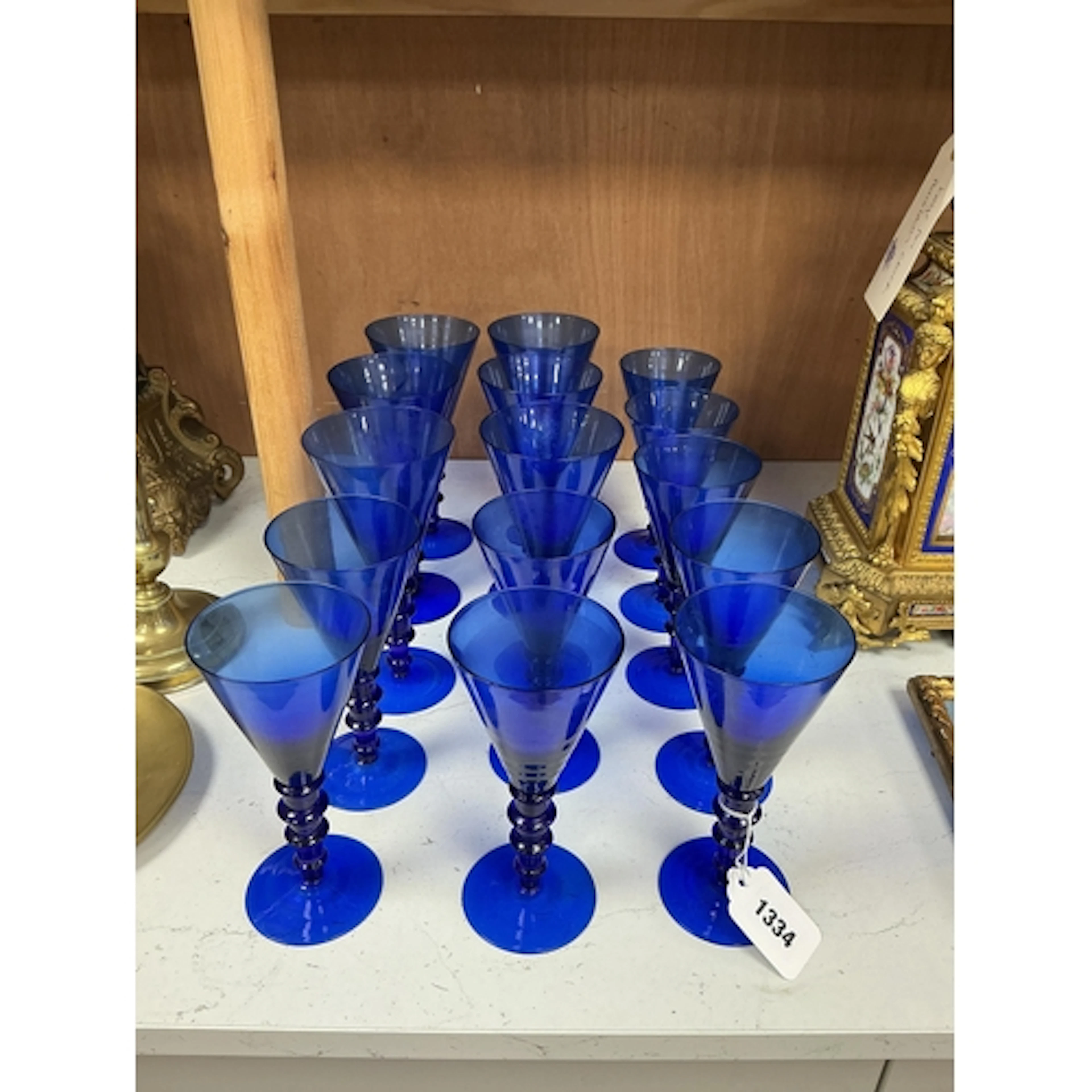 Fifteen Venetian blue glass knopped stem wines in two sizes,...