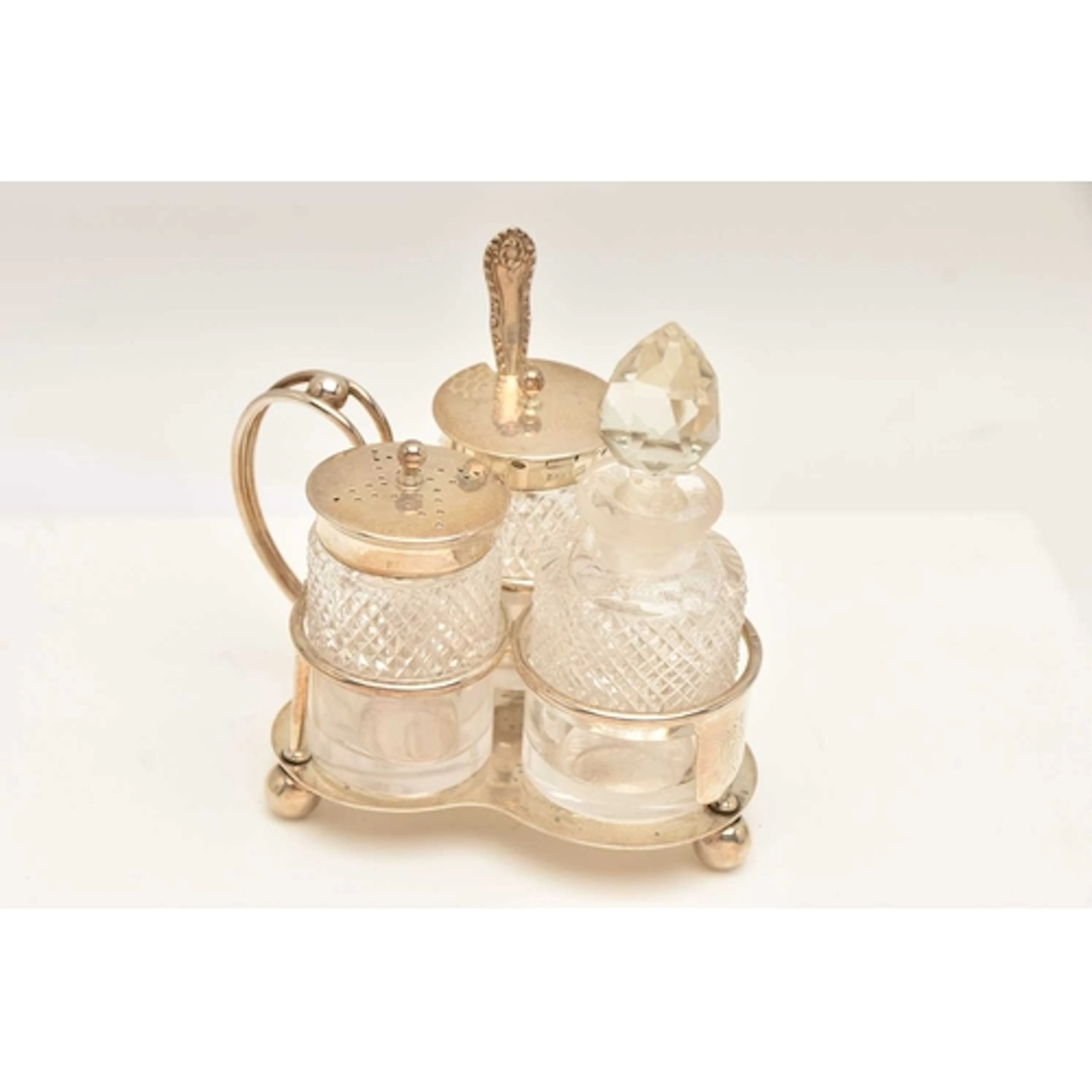 A LATE VICTORIAN SILVER CREUT SET, comprising of a cut glass...