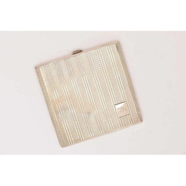 A GEORGE VI SILVER COMPACT, a square form compact with engin...
