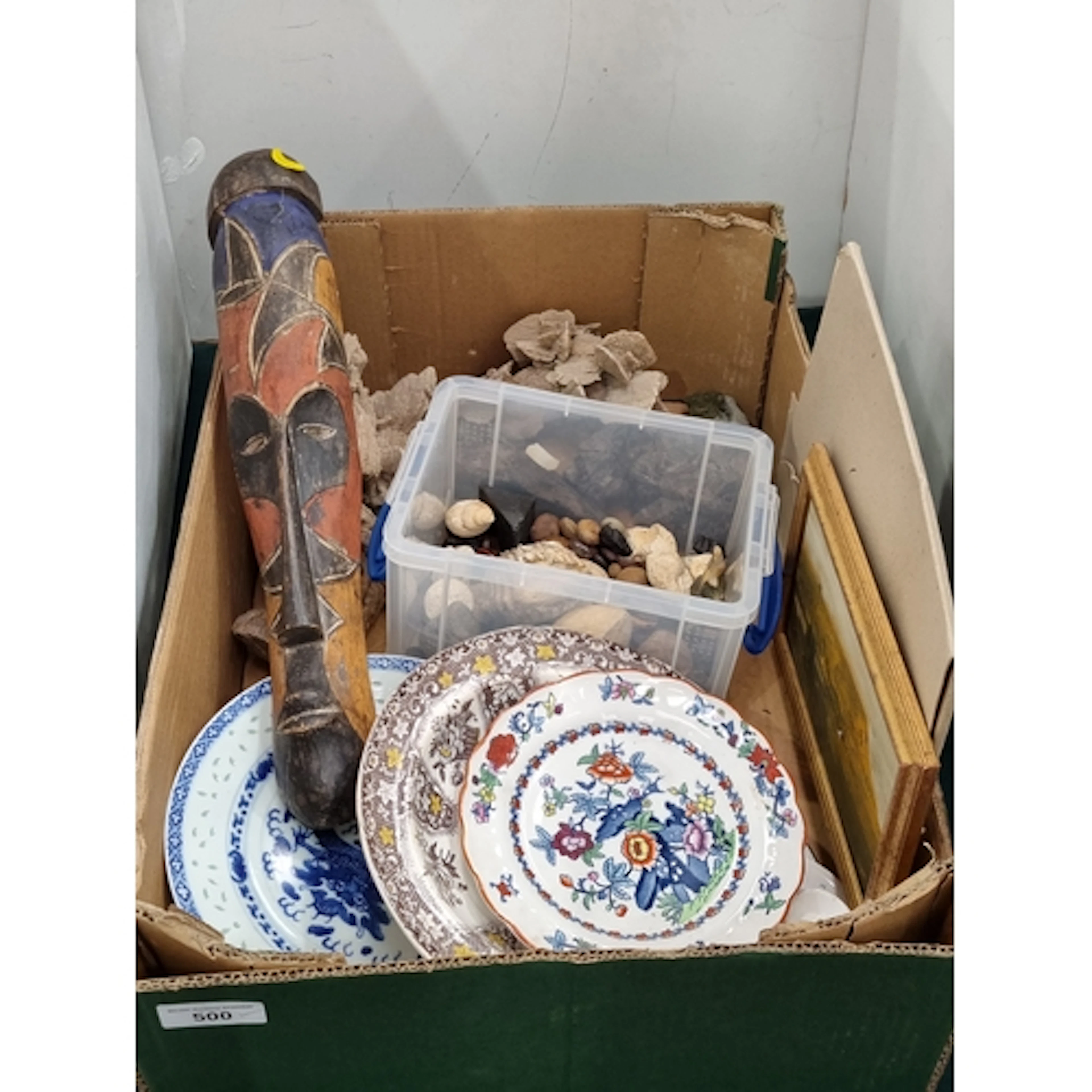 A painted Tribal Mask, pieces of Coral, Shells, Plates, etc,...