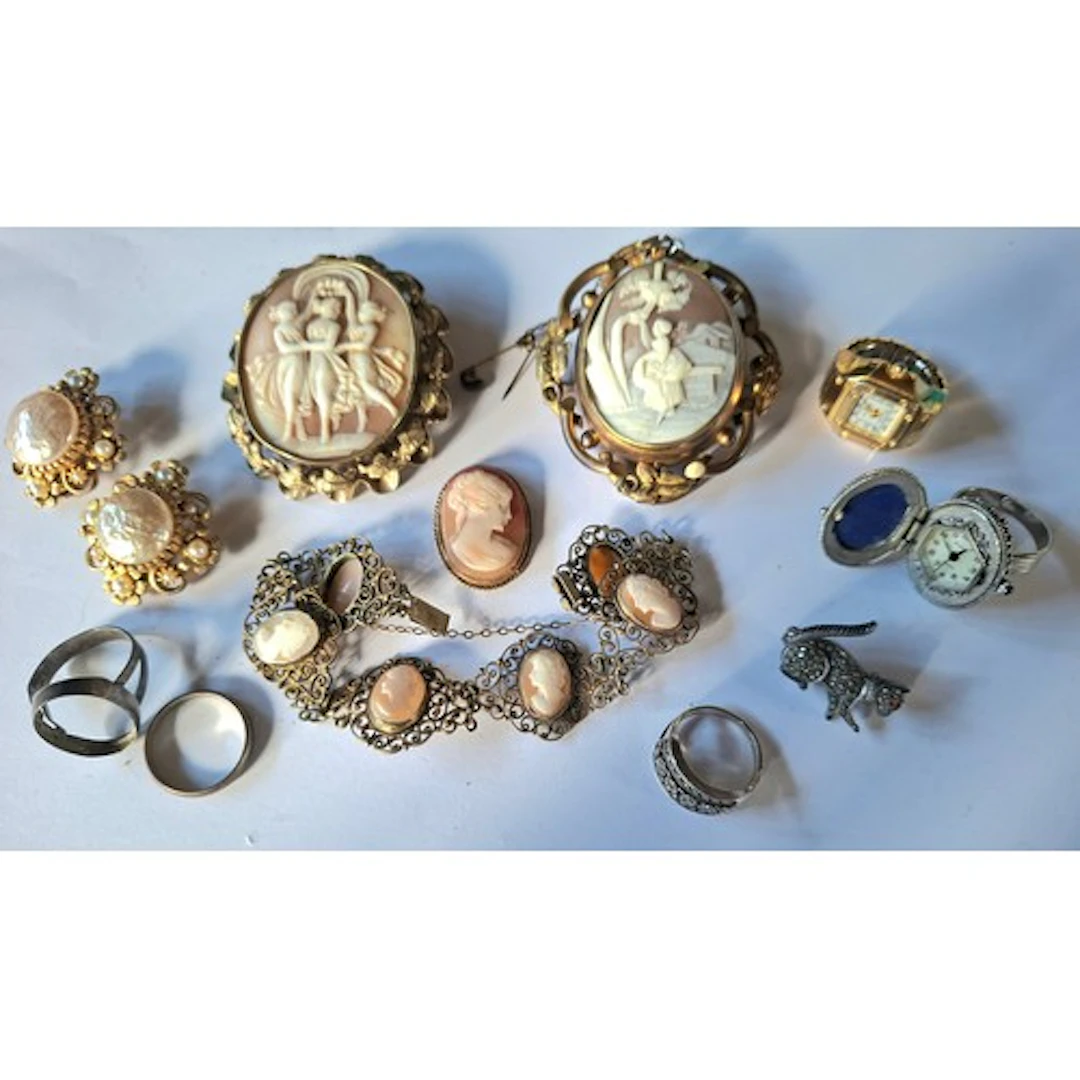 Two large Pinchbeck cameo brooches to include a rotating exa...