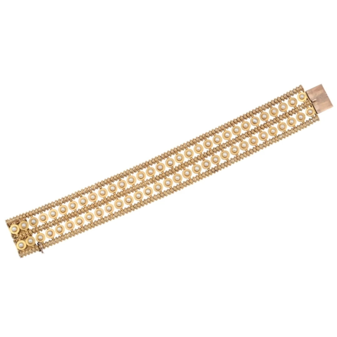 A Victorian gold and pearl bracelet, late 19th century, comp...