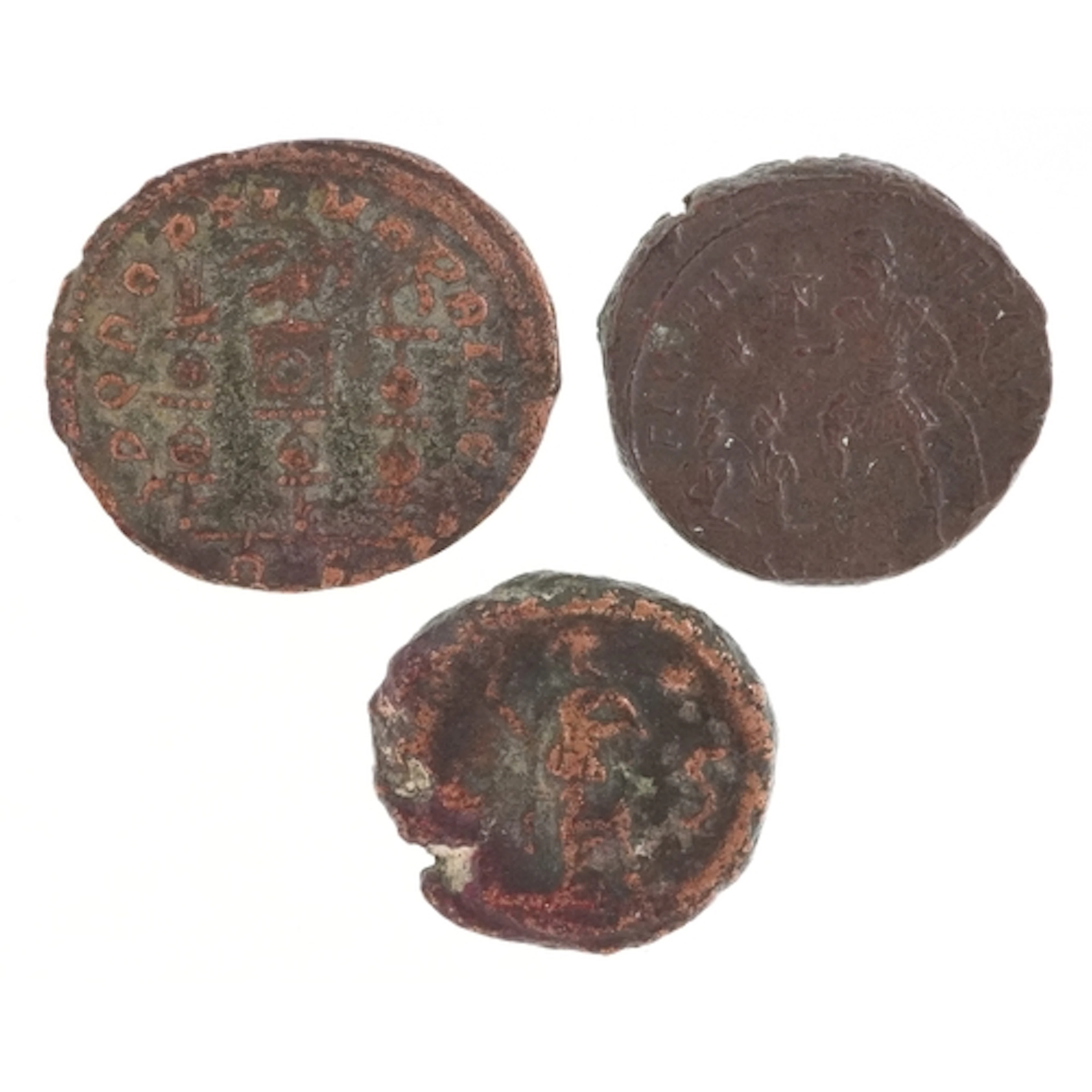 Three Ancient Roman bronze coins of various emperors includi...