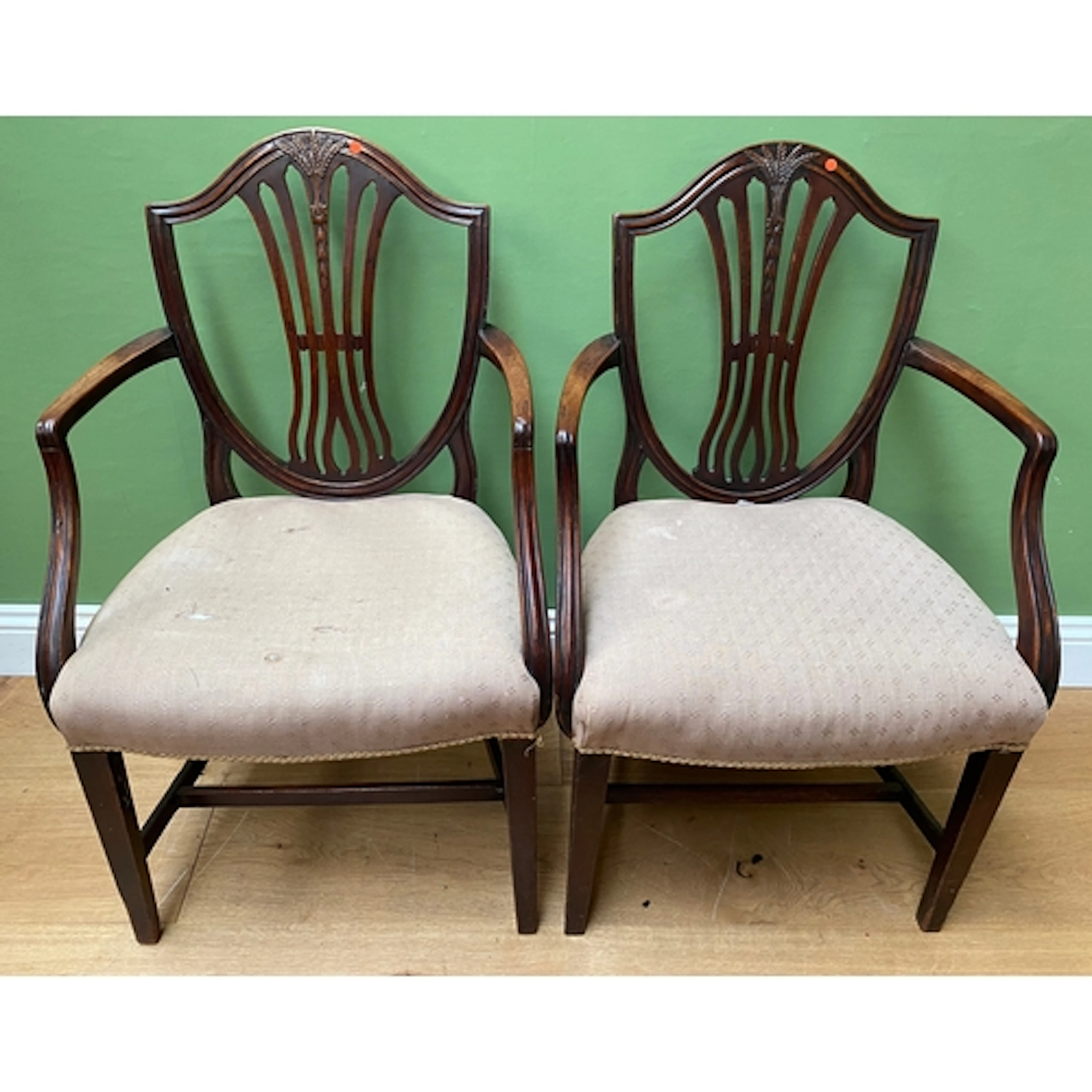 A pair of mahogany open armchair s in Hepplewhite taste, wit...