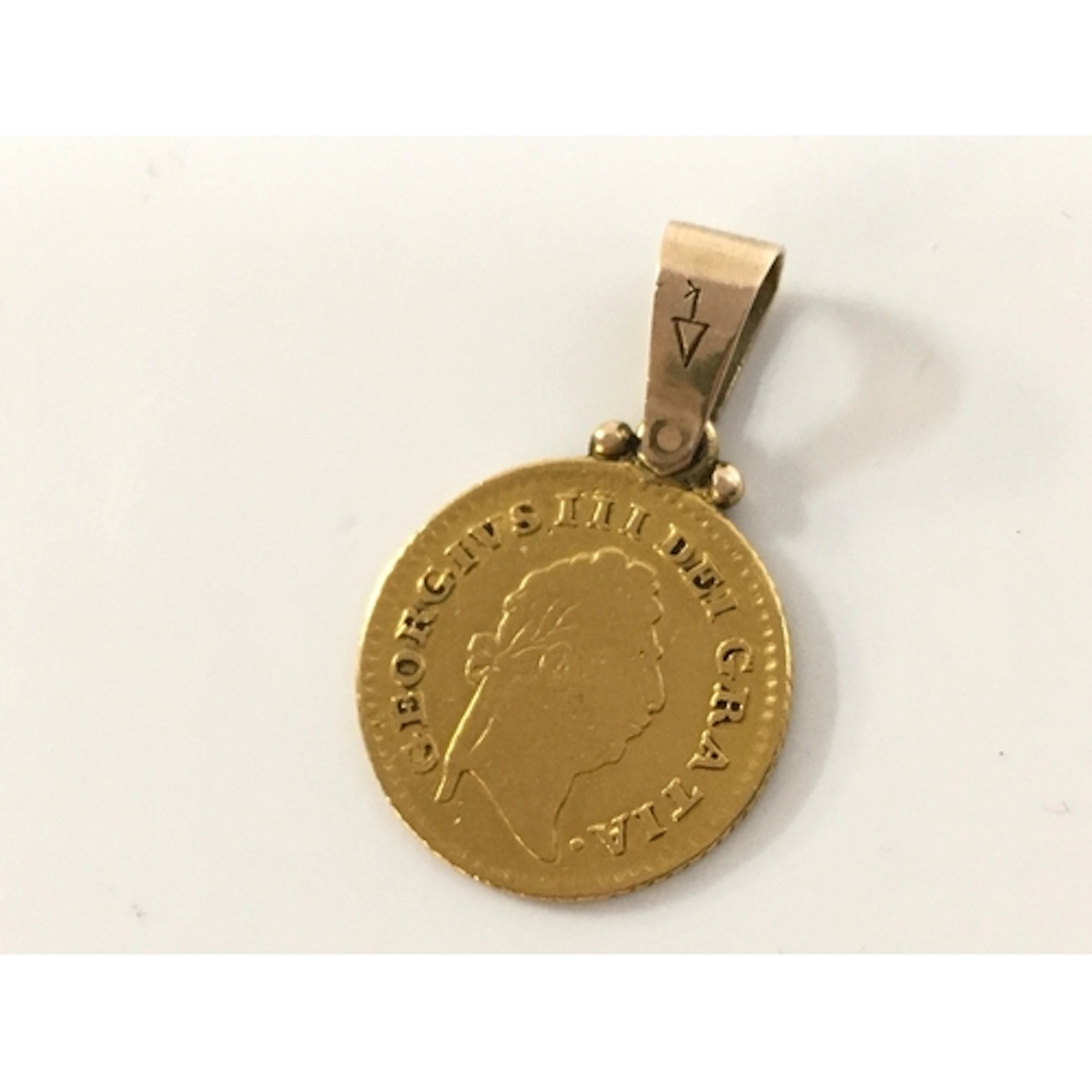 A third Guinea coin, 3.2g total weight